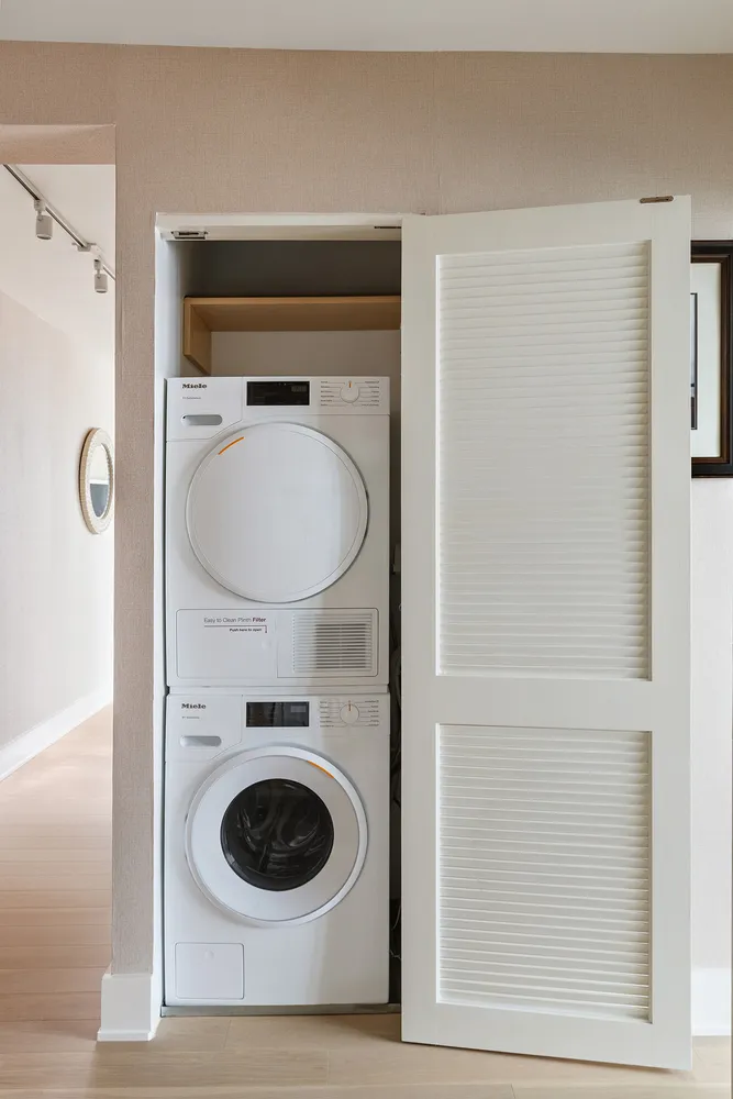 a bathroom with a toilet and a mirror