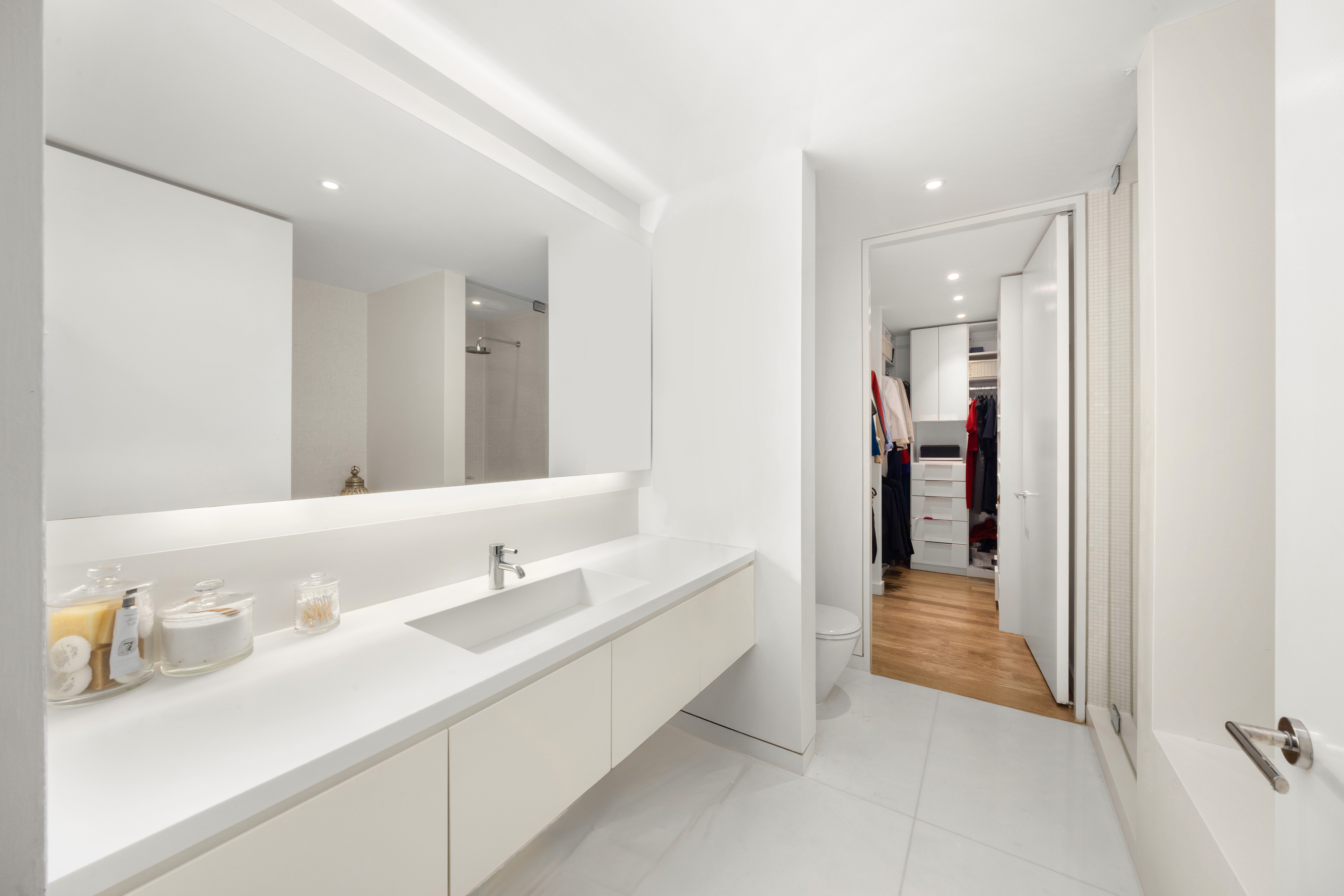 1 Grand Army Plaza, Unit 3C Brooklyn, NY 11238 - Photo 12 of 23 a en suite bathroom with a sink and a mirror