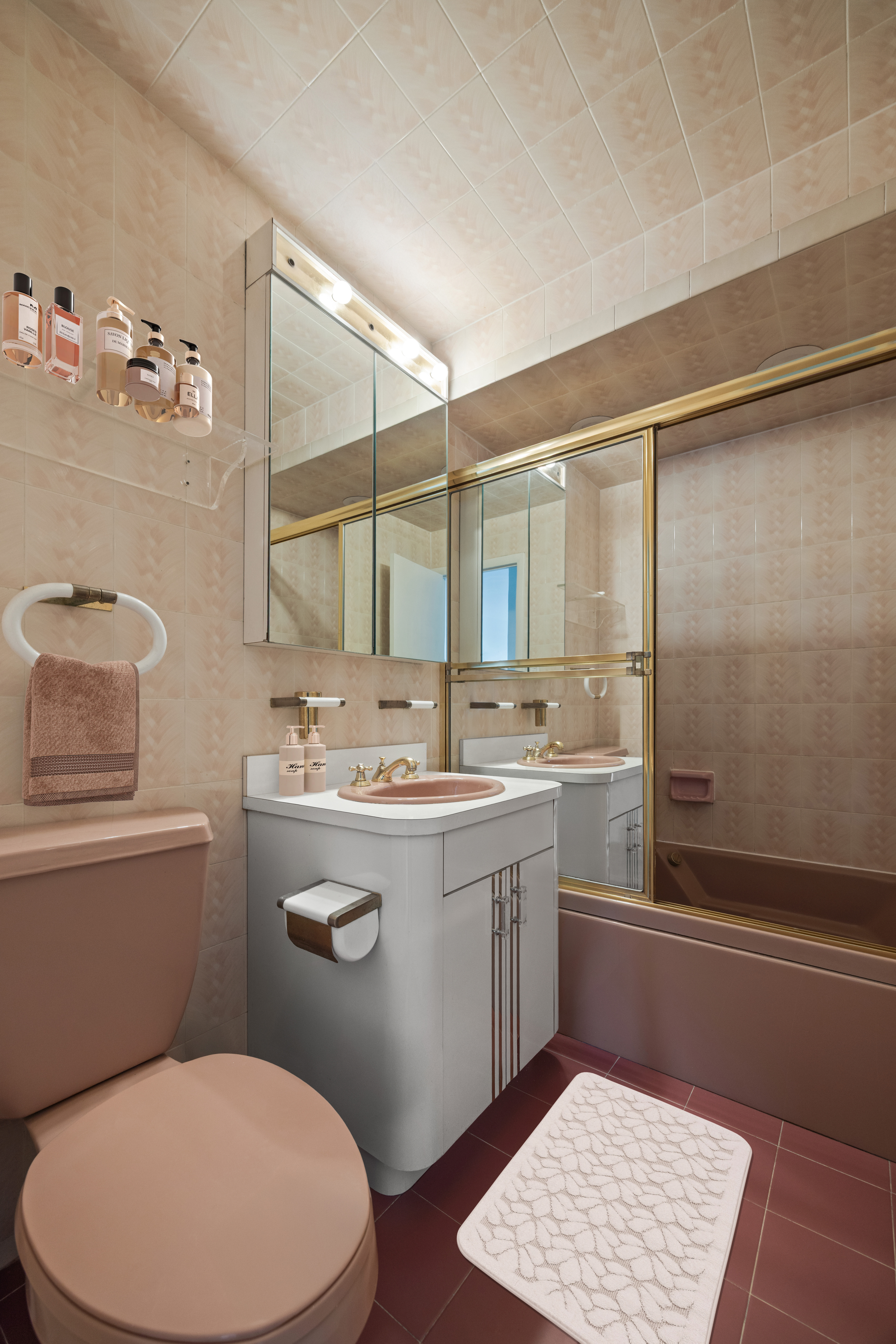 400 East 85th Street, Unit 14A Manhattan, NY 10028 - Photo 6 of 8 a bathroom with a granite countertop sink toilet and shower