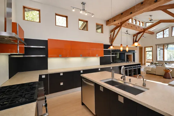 a kitchen with stainless steel appliances a sink and a stove