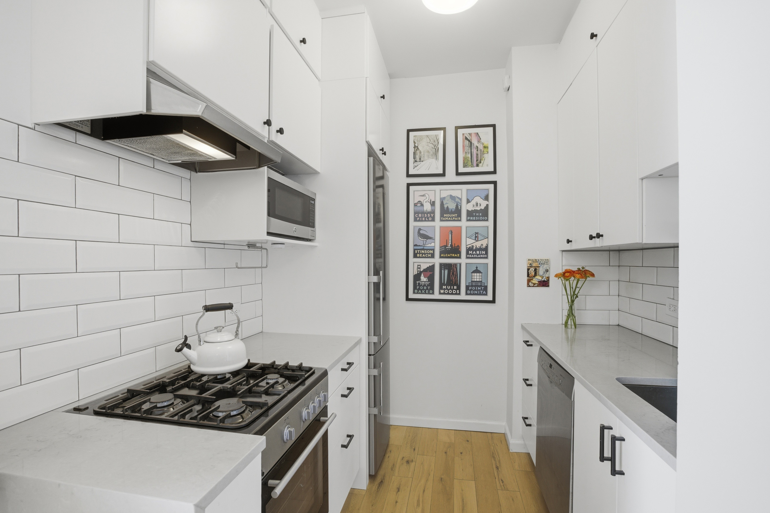 96 Schermerhorn Street, Unit 12A Brooklyn, NY 11201 - Photo 3 of 13 a kitchen with stainless steel appliances a stove and a refrigerator
