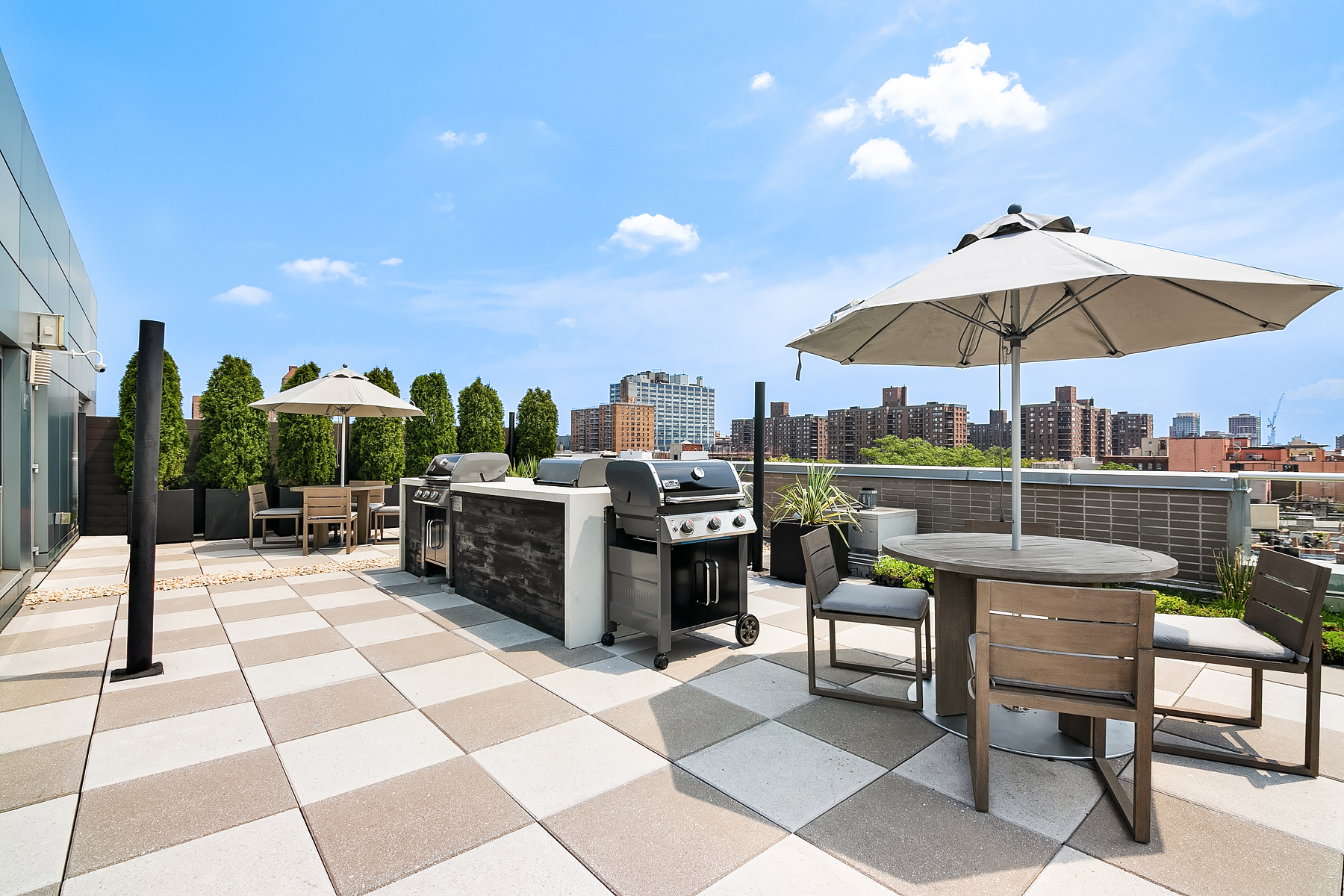 171 West 131st Street, Unit PH3 Manhattan, NY 10027 - Photo 8 of 13 a view of a terrace with furniture and a garden