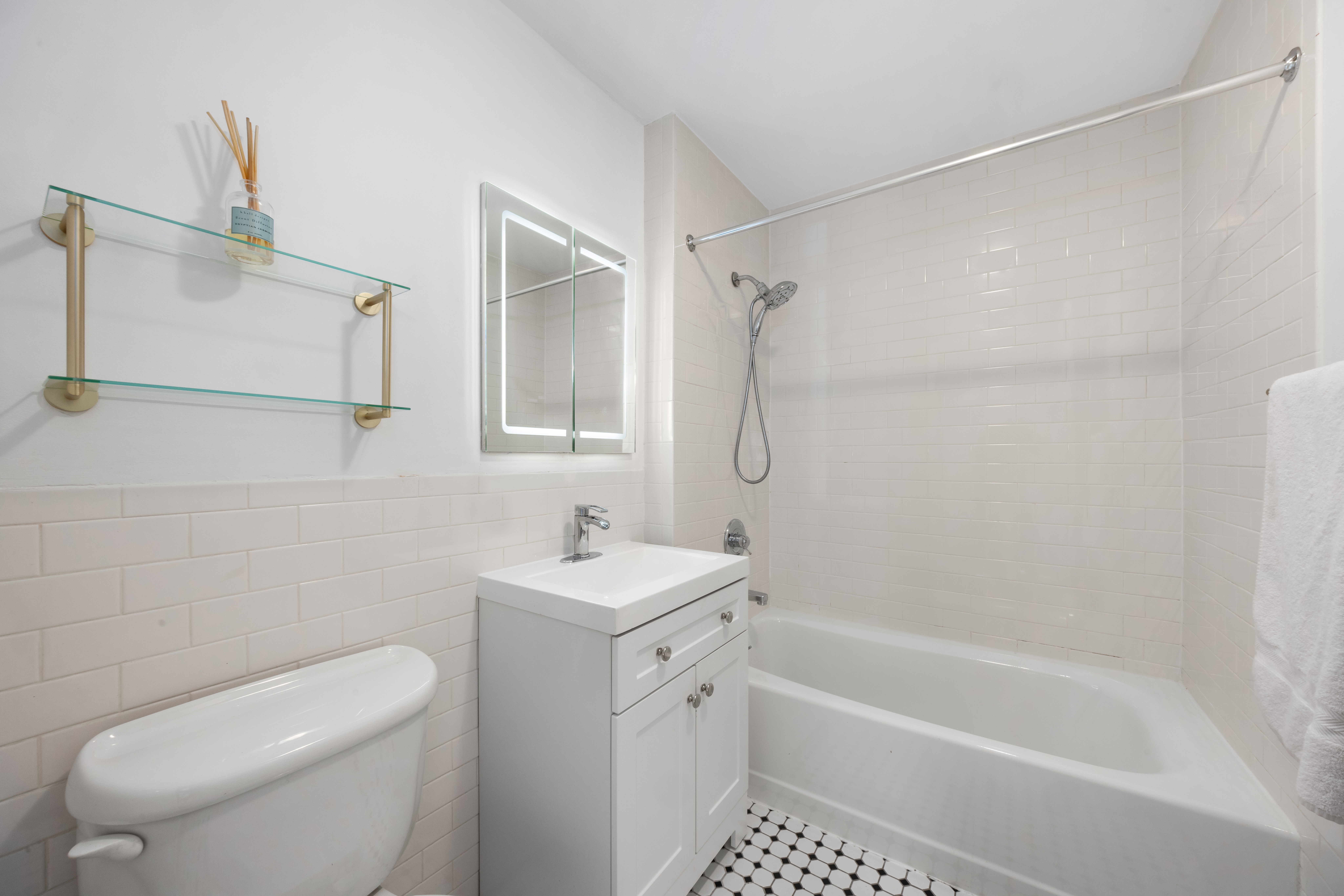 150 South 1st Street, Unit 2K Brooklyn, NY 11211 - Photo 5 of 12 a bathroom with a shower a toilet and sink