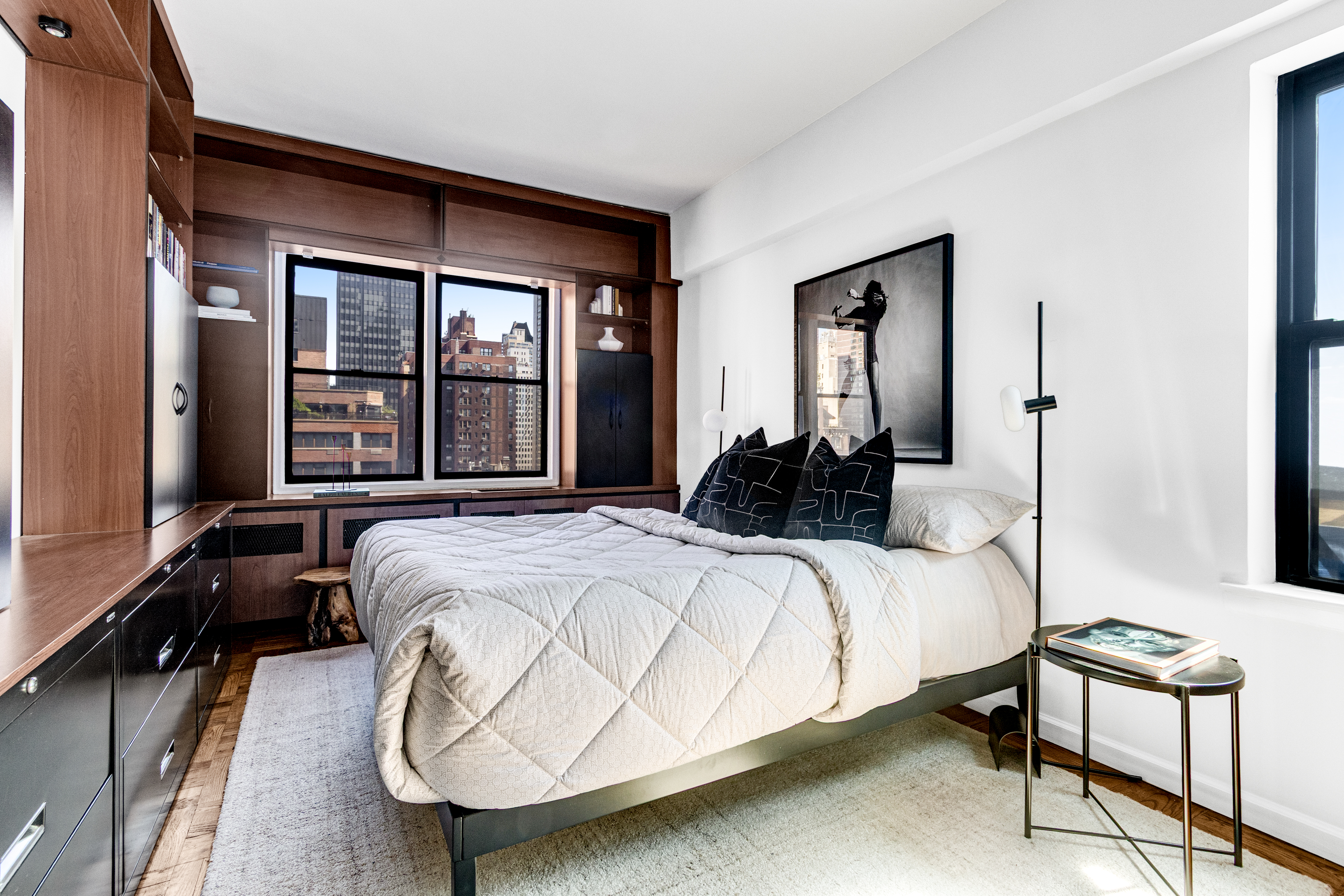 345 East 52nd Street, Unit 10CD Manhattan, NY 10022 - Photo 9 of 14 a bedroom with a bed and wooden floor