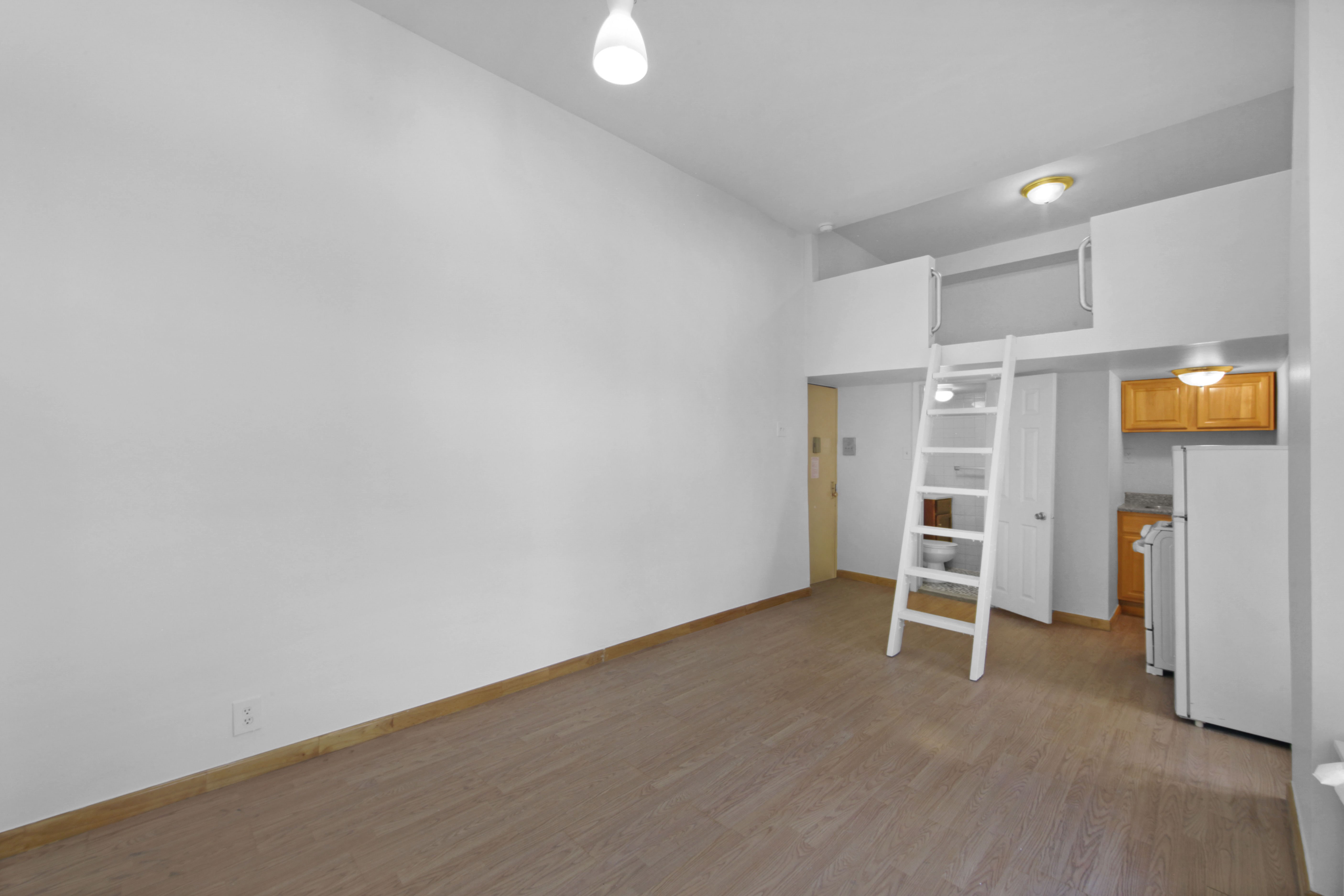 155 Hicks Street, Unit 2B Brooklyn, NY 11201 - Photo 7 of 11 a view of empty room with wooden floor