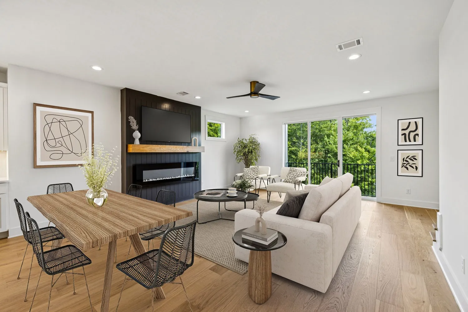 a living room with furniture a flat screen tv and a large window