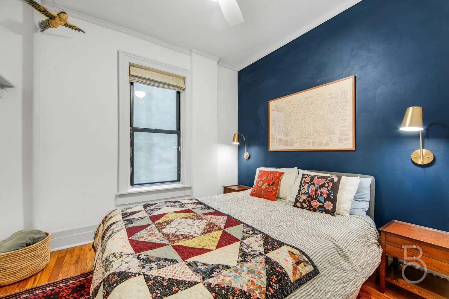 a bedroom with bed and a window