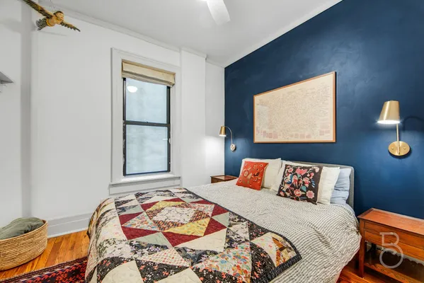 a bedroom with bed and a window