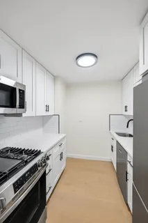 a kitchen with stainless steel appliances a stove and a refrigerator
