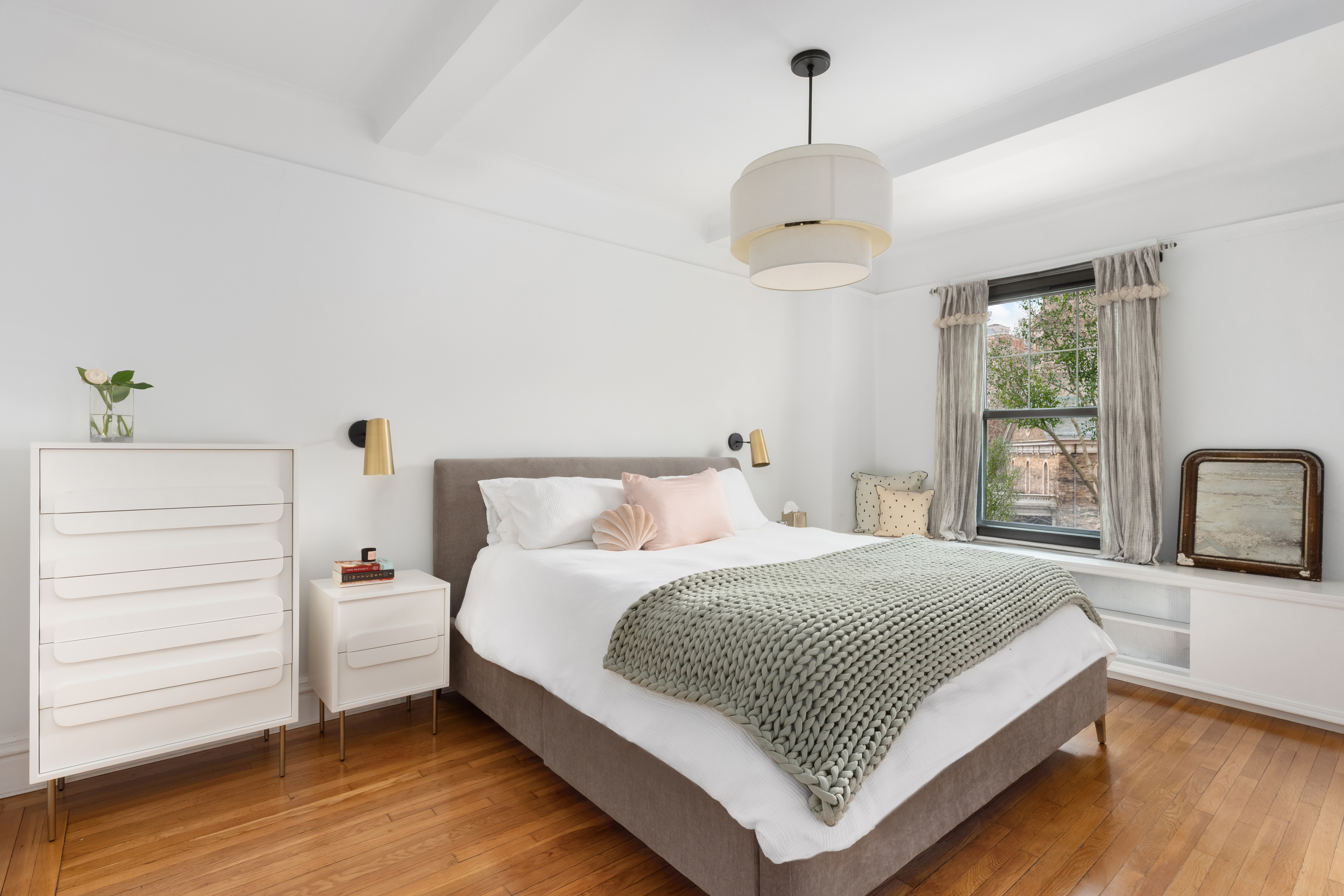 170 2nd Avenue, Unit 4A Manhattan, NY 10003 - Photo 3 of 11 a bedroom with a bed and a dresser