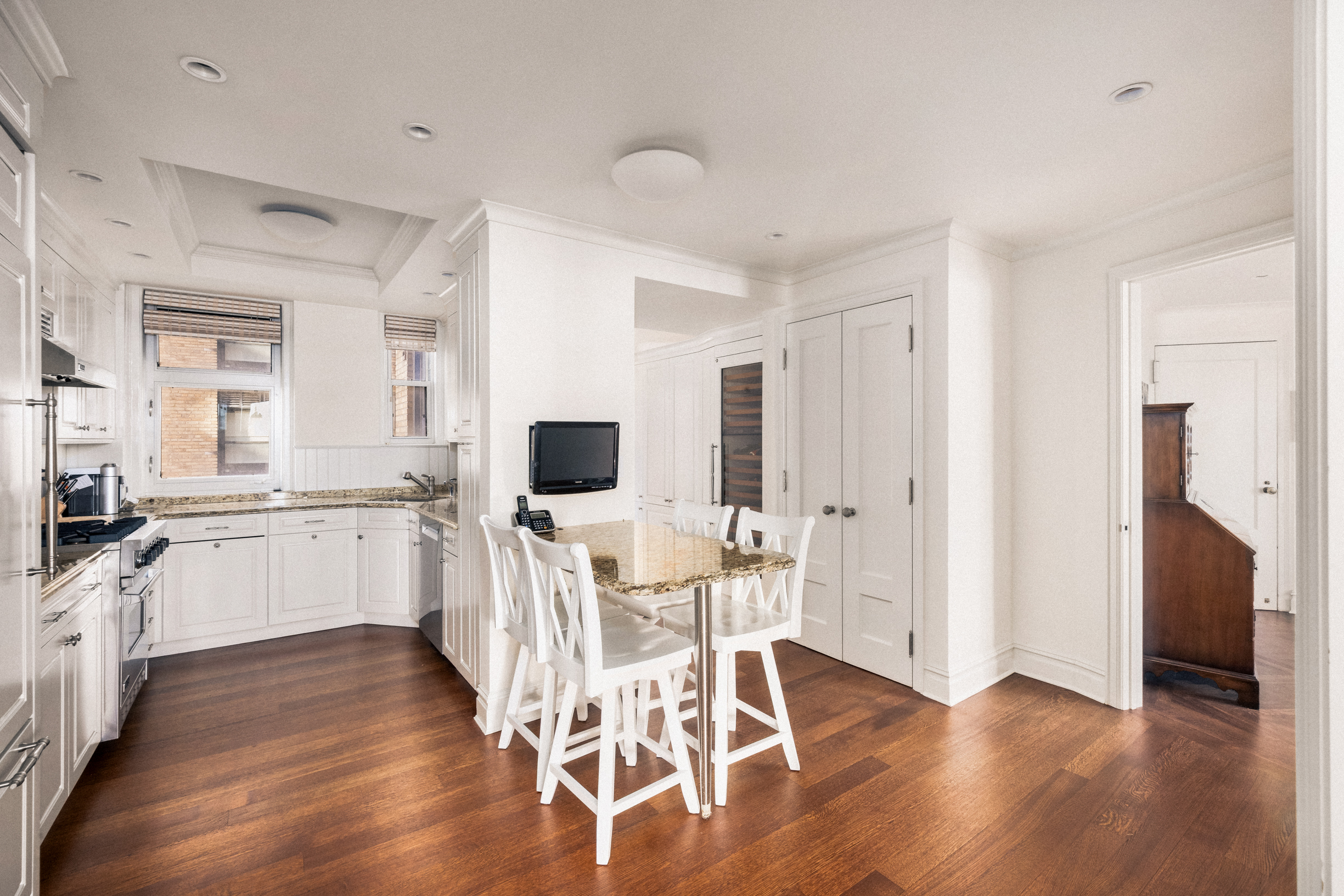 33 Riverside Drive, Unit 13AB Manhattan, NY 10023 - Photo 8 of 19 a kitchen with a sink cabinets and wooden floor
