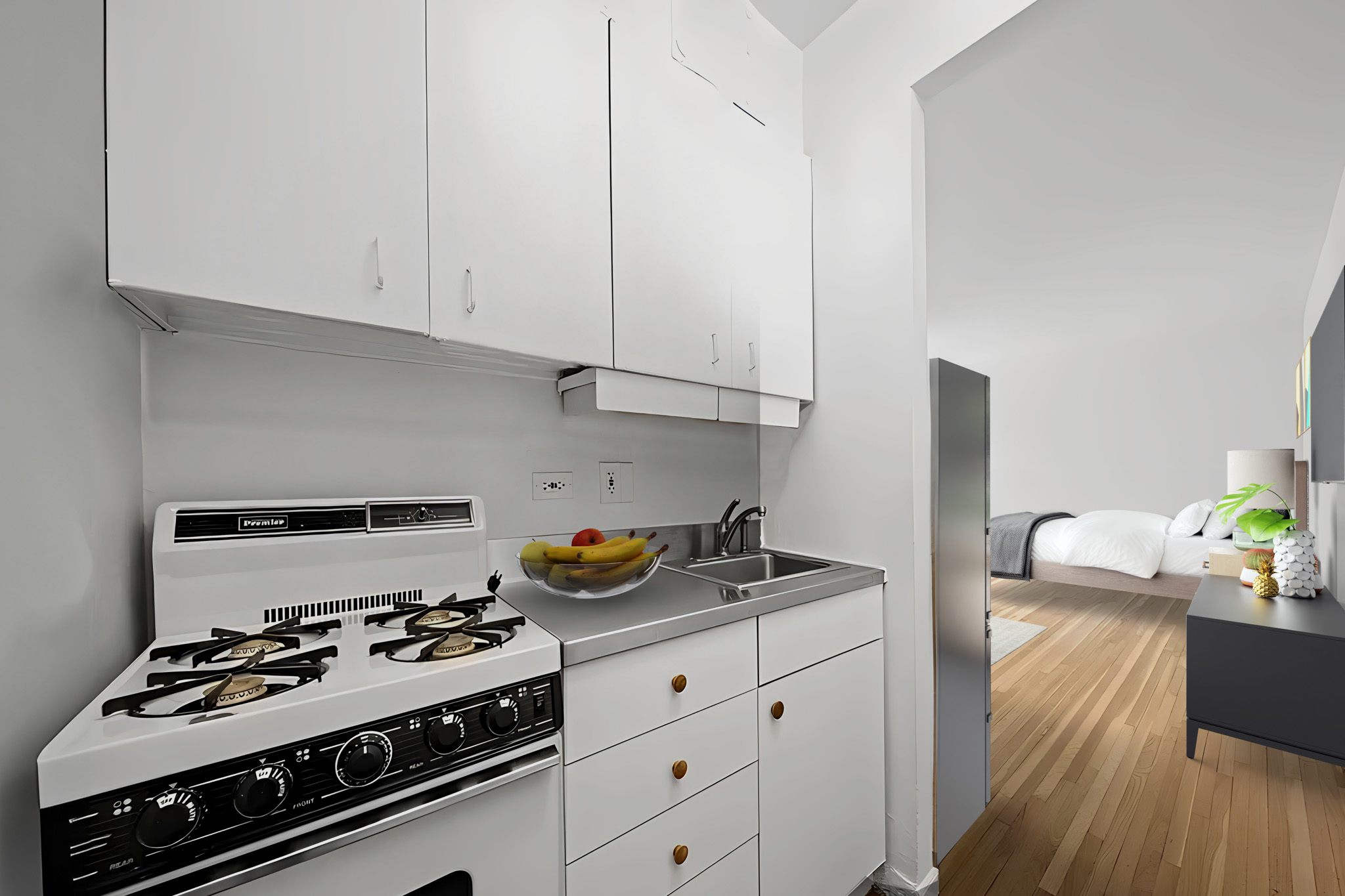 60 East 9th Street, Unit 235 Manhattan, NY 10003 - Photo 11 of 14 a kitchen with stainless steel appliances a stove a white cabinets and wooden floor