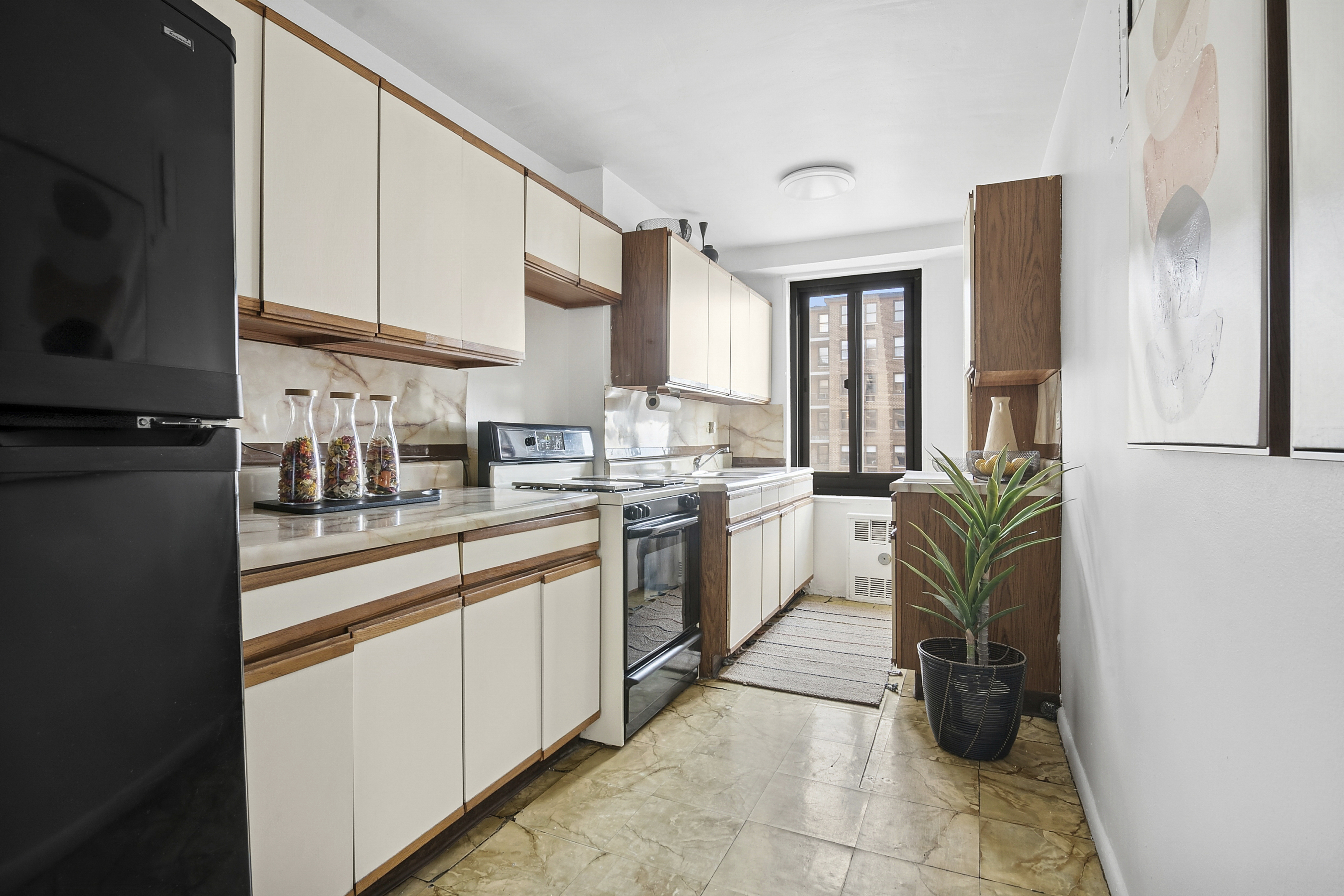 195 Willoughby Avenue, Unit 1206 Brooklyn, NY 11205 - Photo 4 of 10 a kitchen with a sink cabinets and appliances