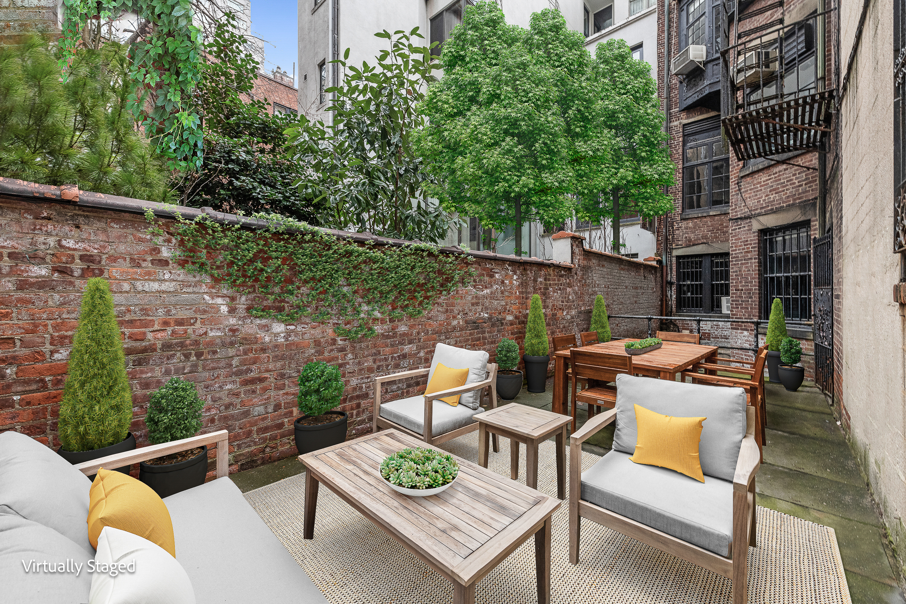 155 East 70th Street Manhattan, NY 10021 - Photo 18 of 27 a backyard of a house with outdoor seating