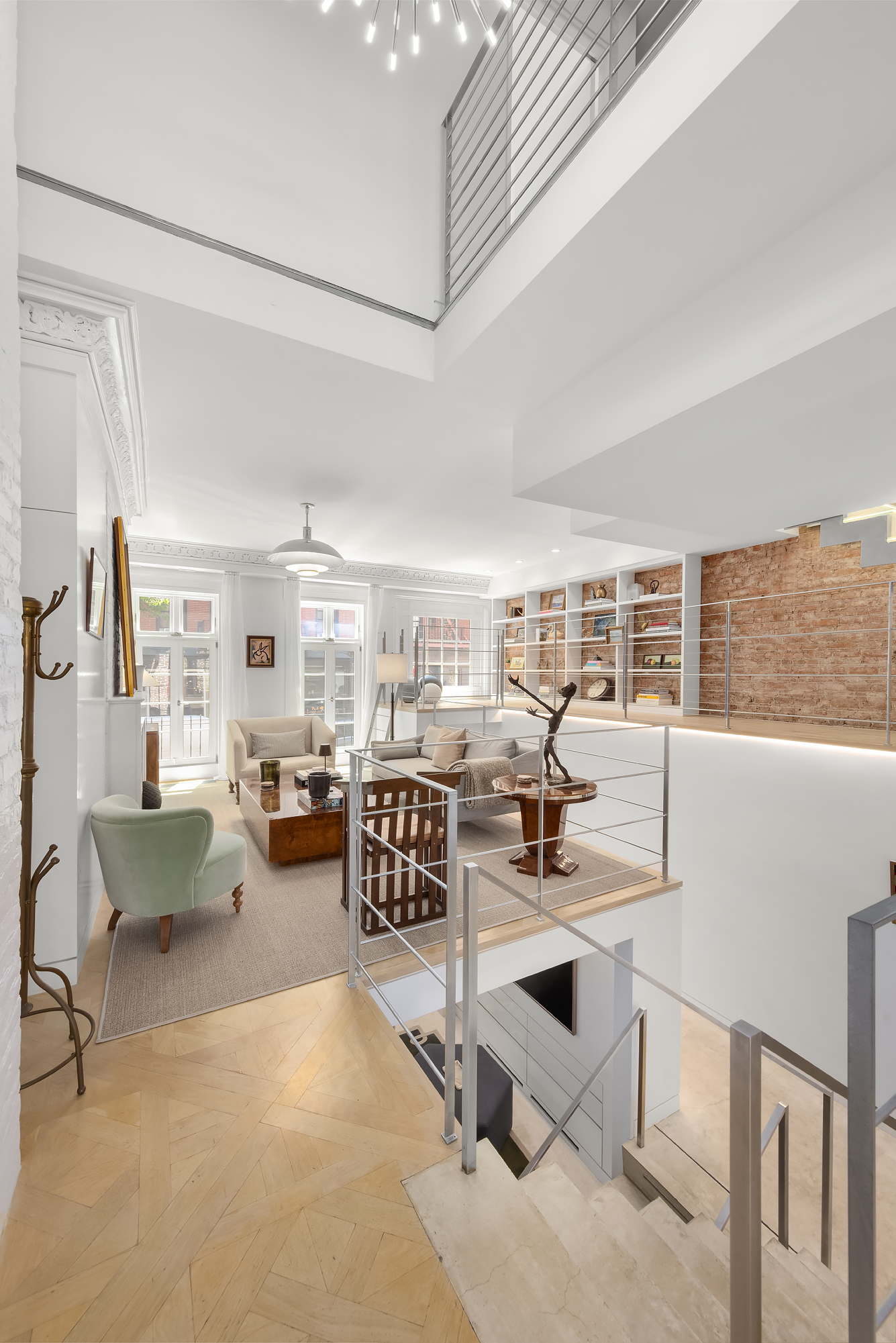 21 Cornelia Street Manhattan, NY 10014 - Photo 7 of 26 a view of a livingroom with workspace and dining room view