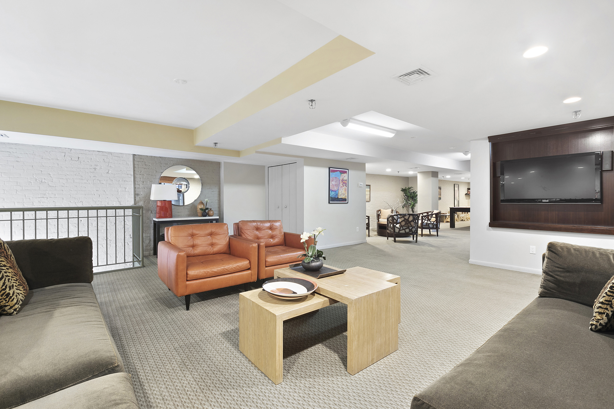 25 Murray Street, Unit 4A Manhattan, NY 10007 - Photo 10 of 11 a living room with furniture and a flat screen tv