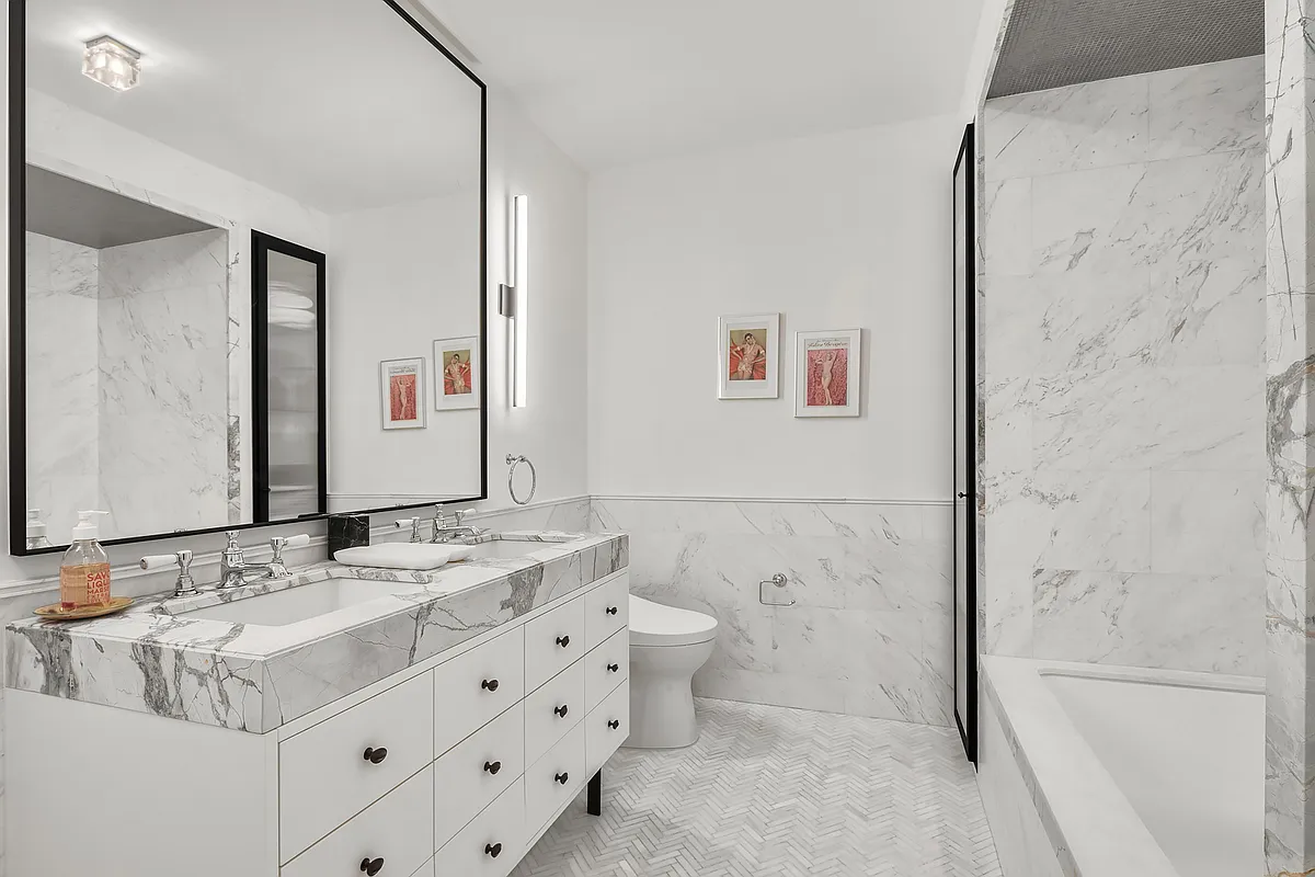 438 East 12th Street, Unit 6F Manhattan, NY 10009 - Photo 8 of 27 a bathroom with a sink double vanity and a shower