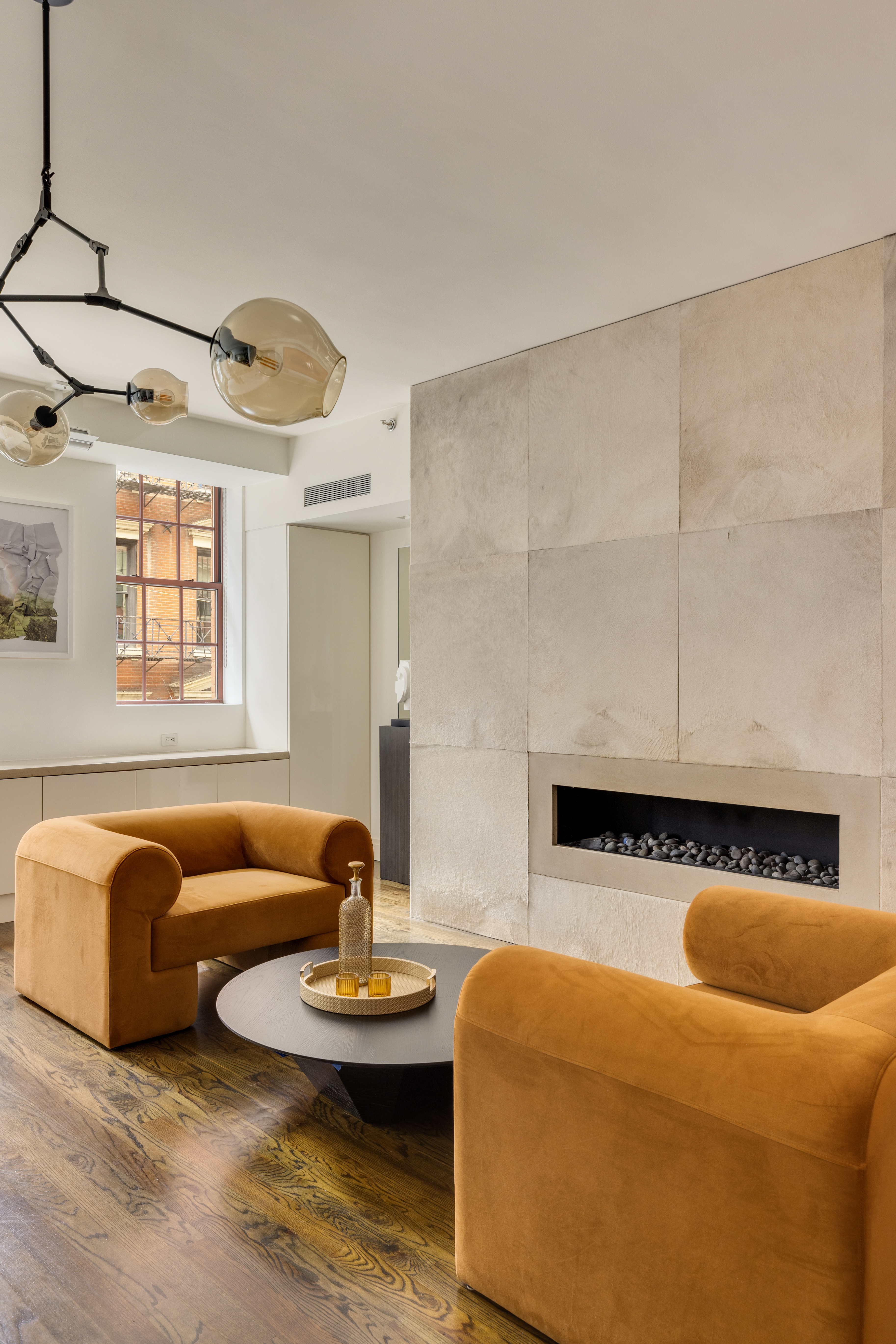 18 Leonard Street, Unit 2D Manhattan, NY 10013 - Photo 7 of 22 a living room with furniture and a fireplace