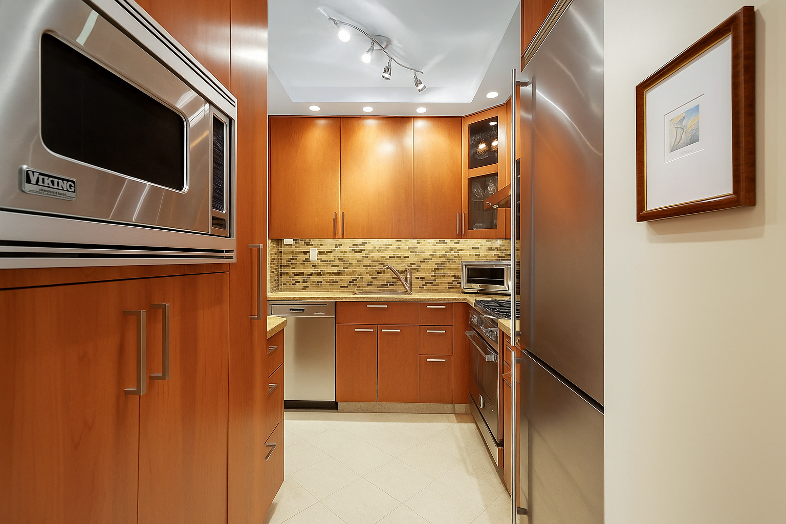 300 East 74th Street, Unit 18E Manhattan, NY 10021 - Photo 3 of 10 a bathroom with a sink and a mirror