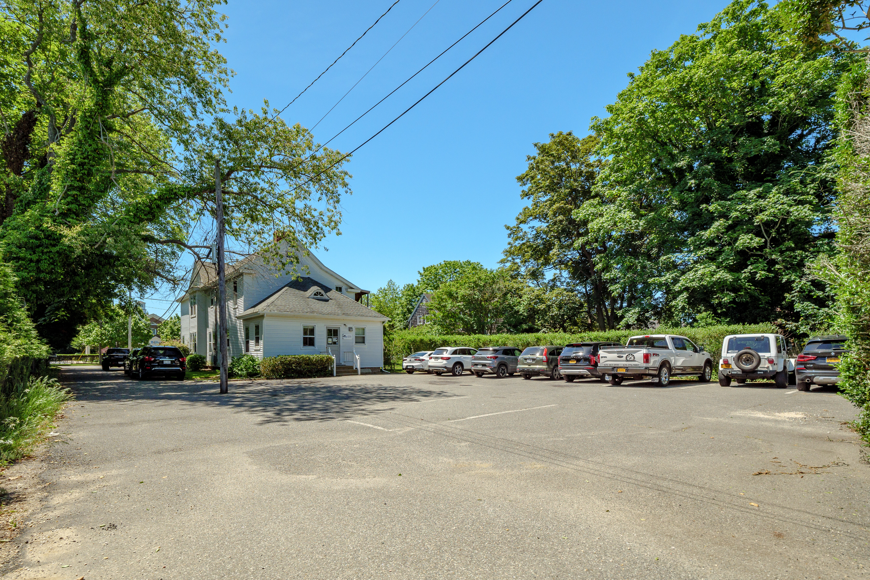 149 Hampton Road Southampton, NY 11968 - Photo 2 of 19 a car parked on the side of the road