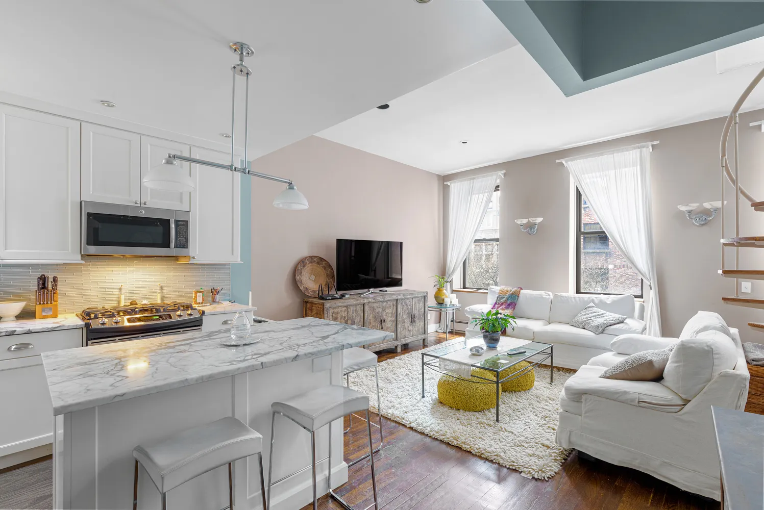 a living room with furniture and a flat screen tv