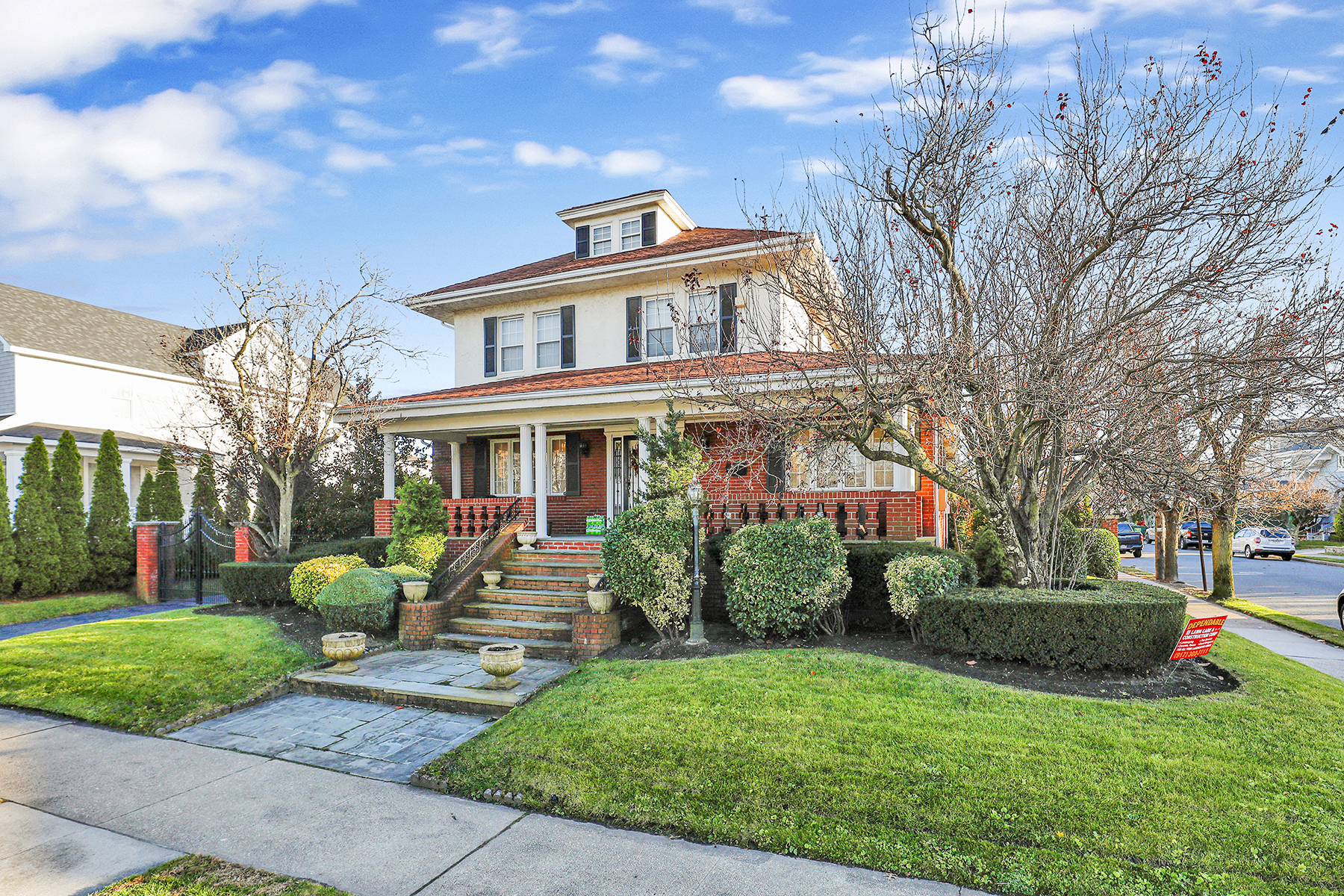 142-15 Newport Avenue Queens, NY 11694 - Photo 46 of 72 a front view of a house with garden and trees