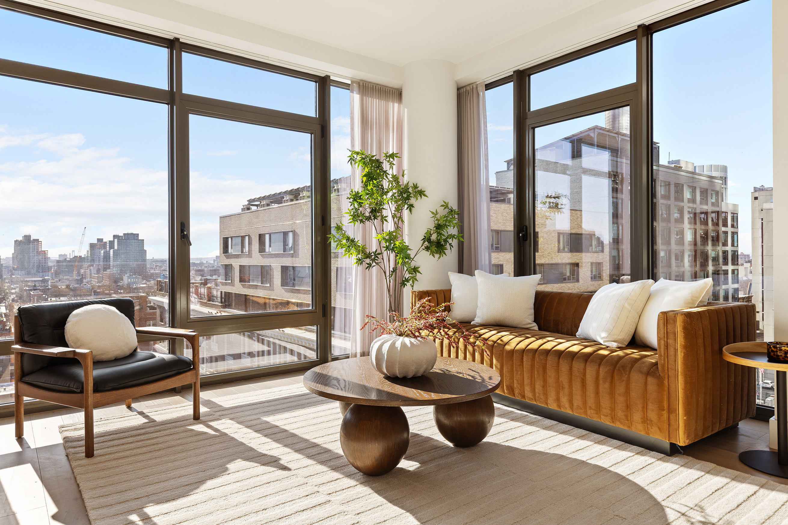 319 Schermerhorn Street, Unit 11B Brooklyn, NY 11217 - Photo 4 of 15 a living room with furniture and a floor to ceiling window