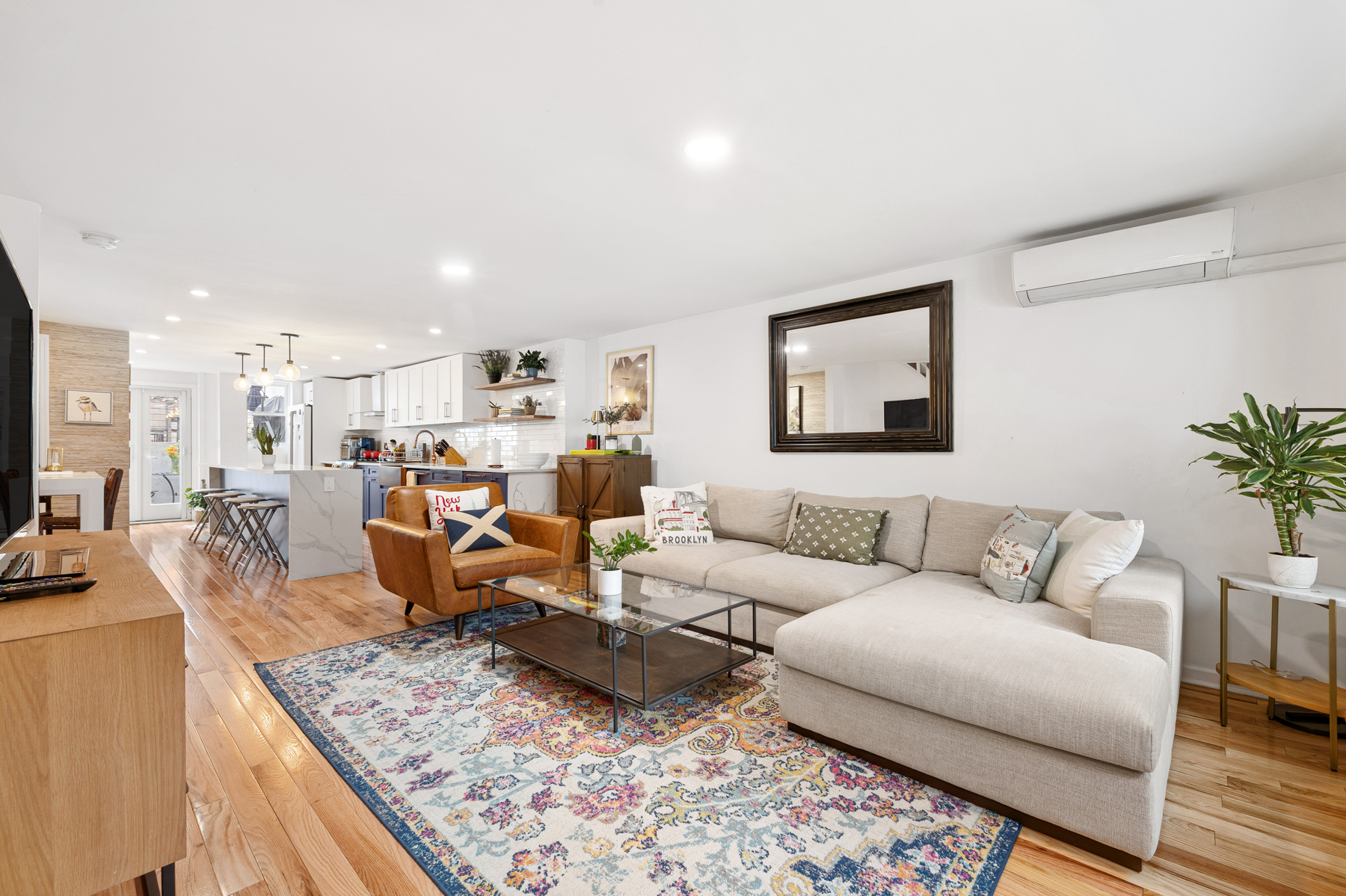 202 22nd Street Brooklyn, NY 11232 - Photo 2 of 28 a living room with furniture kitchen view and a table