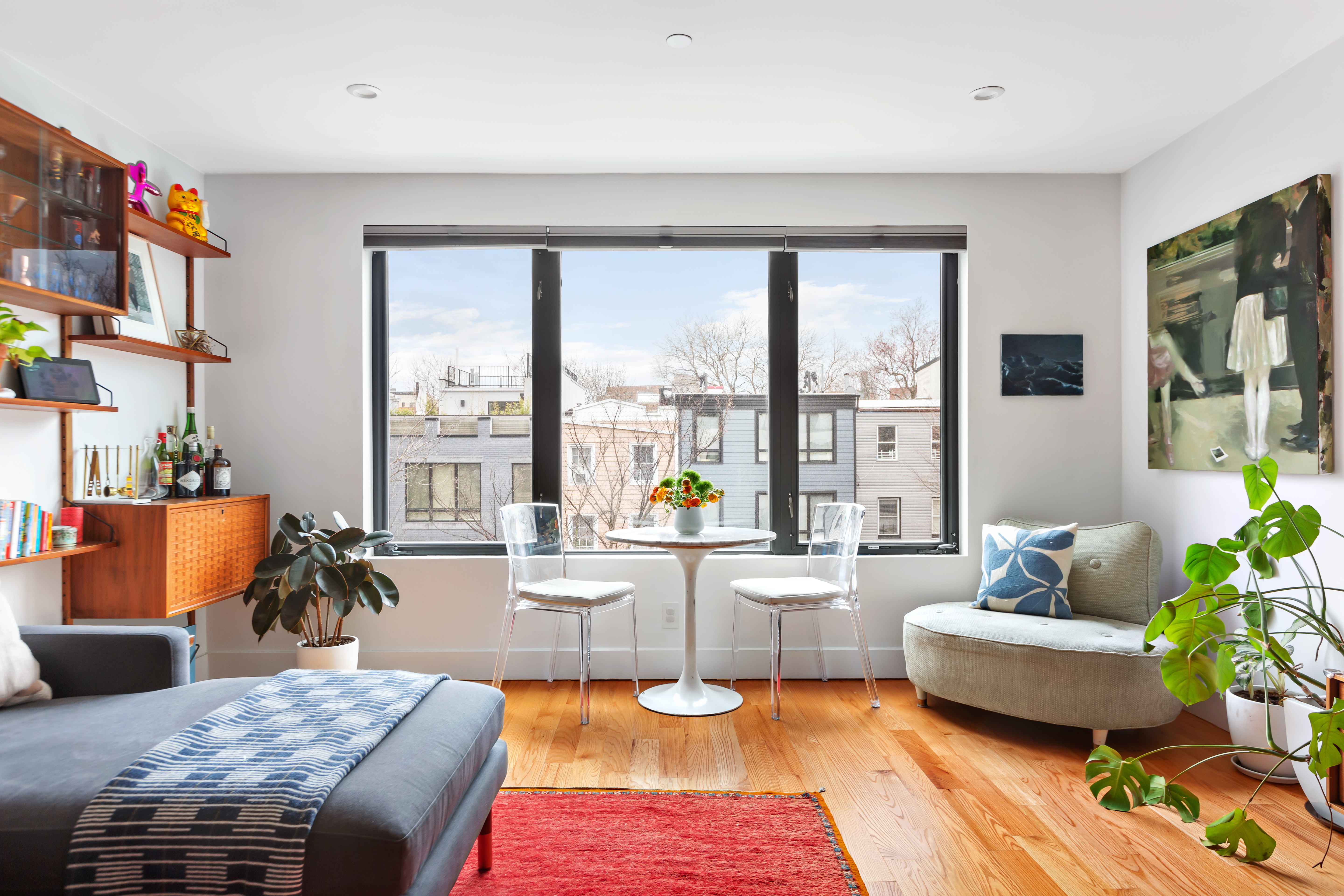 39 Madison Street, Unit 3B Brooklyn, NY 11238 - Photo 2 of 16 a living room with furniture and a large window