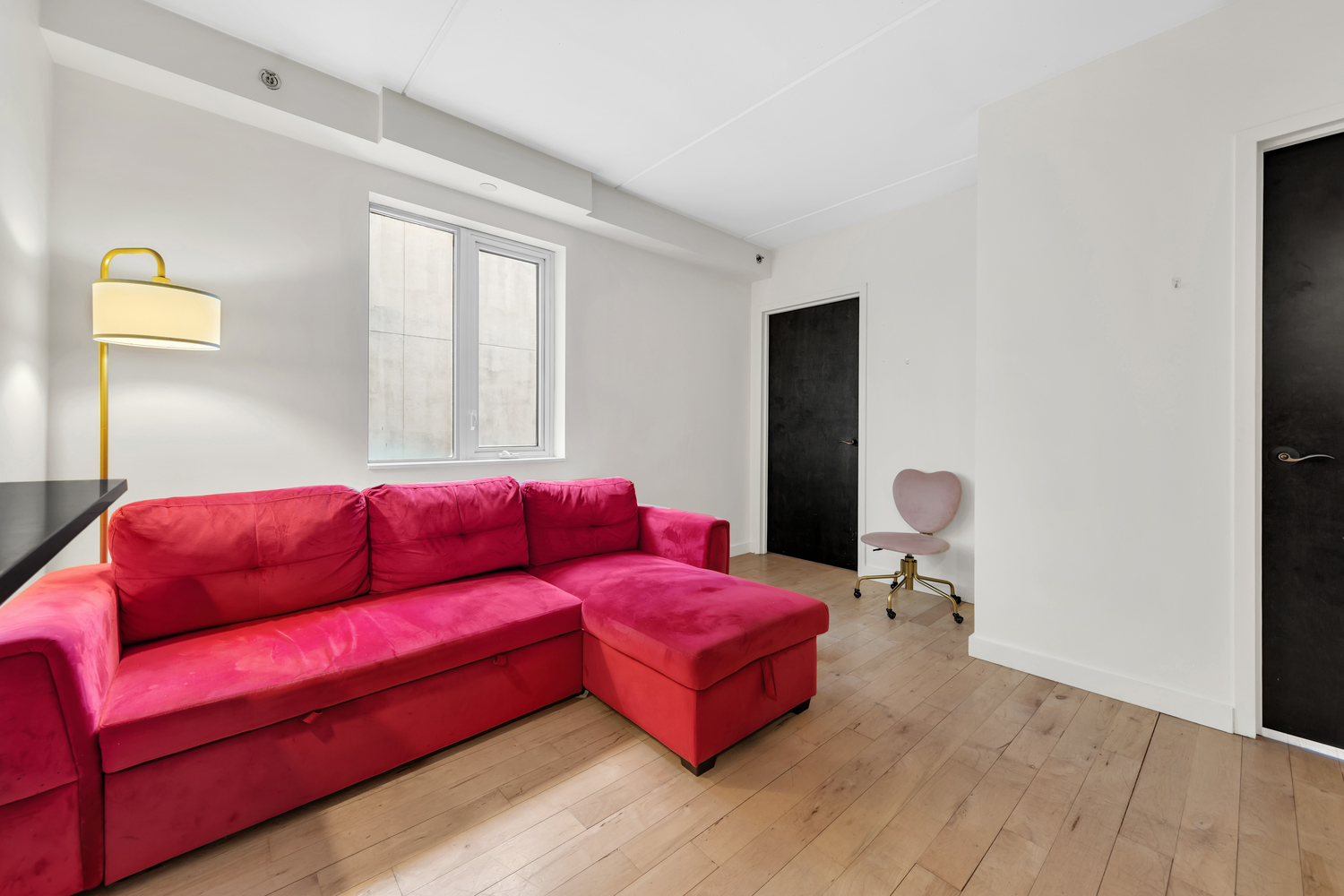1810 3rd Avenue, Unit A7C Manhattan, NY 10029 - Photo 2 of 12 a living room with furniture and a window