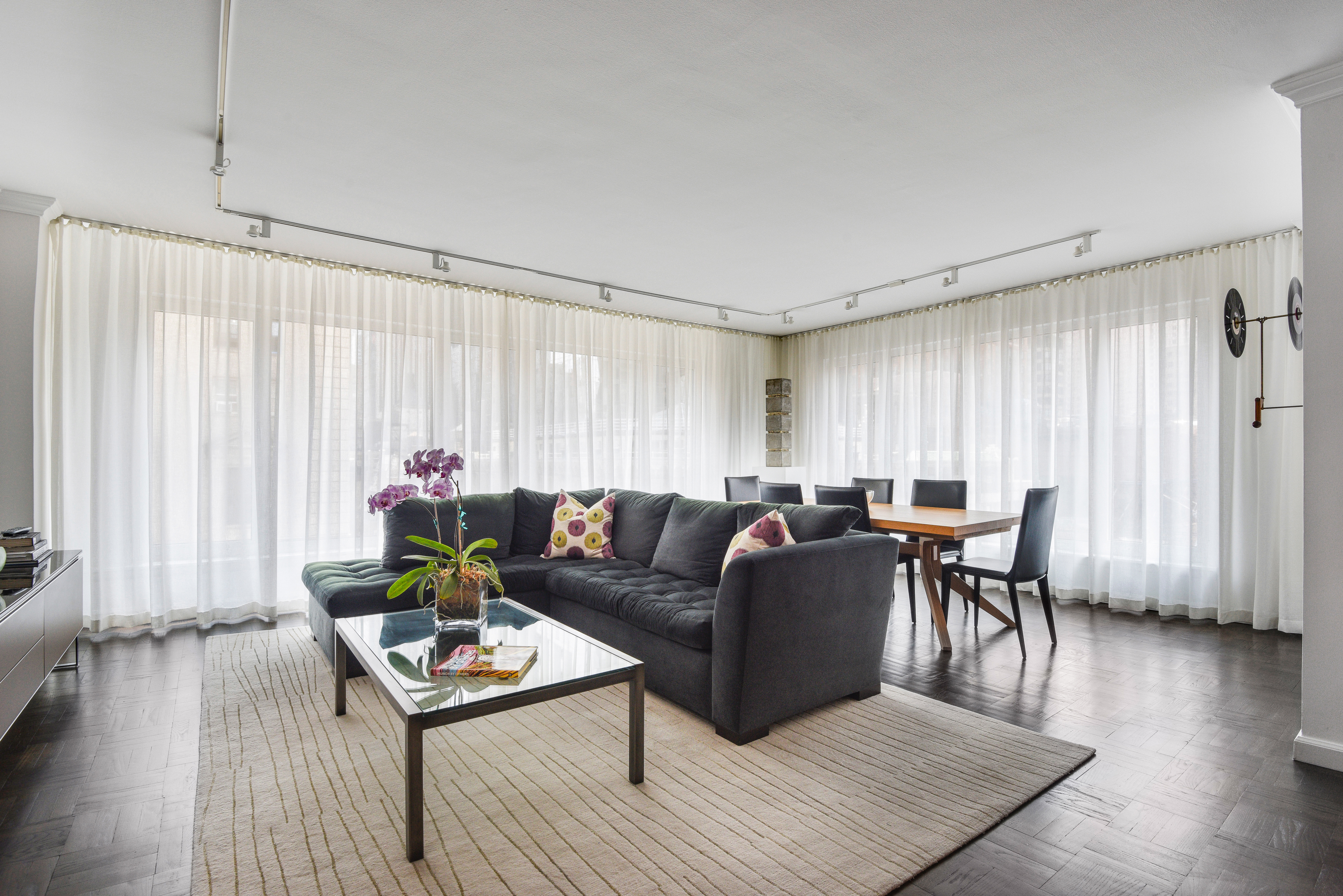 200 Central Park South, Unit 19J Manhattan, NY 10019 - Photo 3 of 12 a living room with furniture and a wooden floor