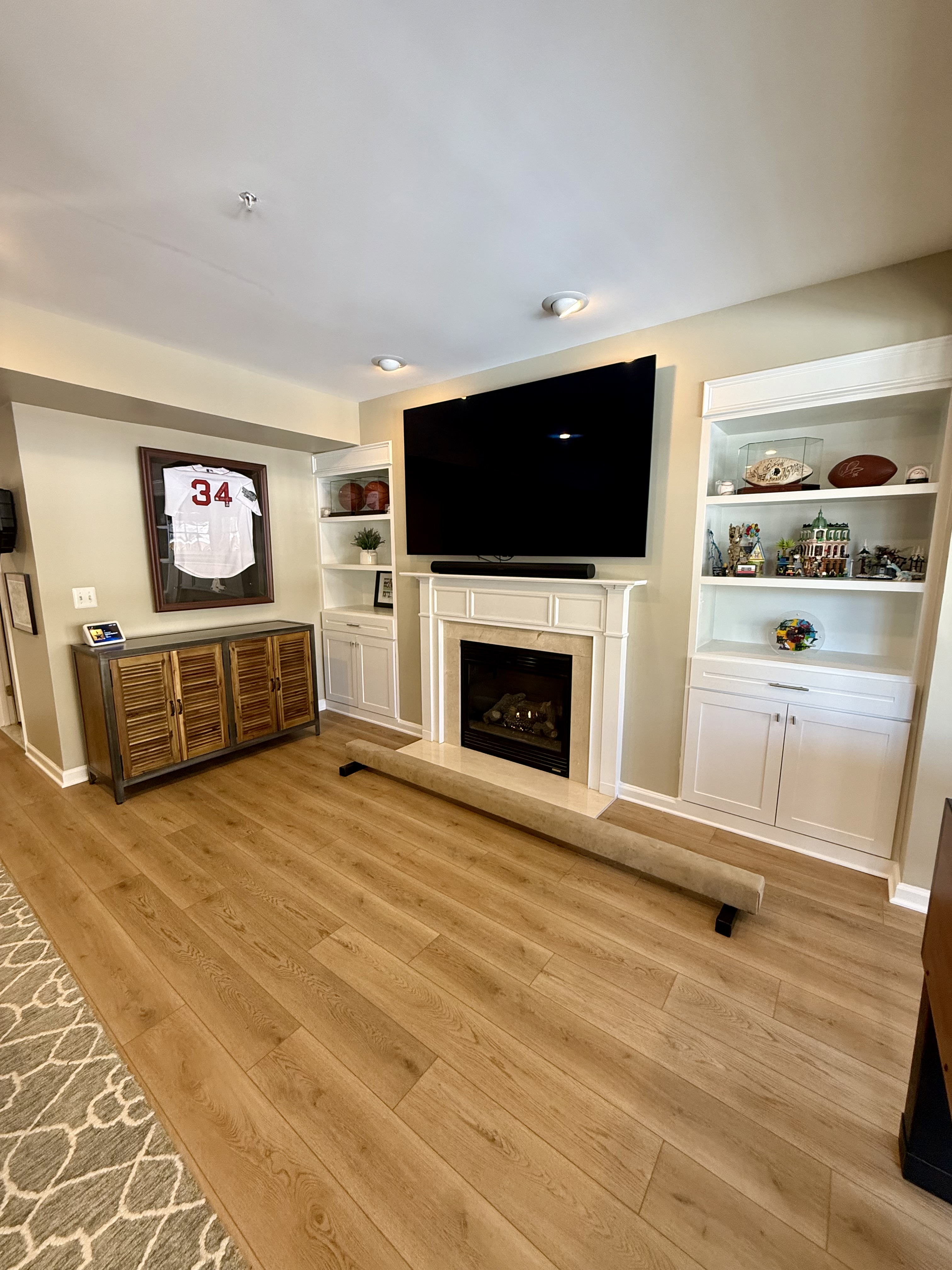 Address Upon Request Leesburg, VA 20176 - Photo 31 of 55 a living room with a flat screen tv and a fireplace