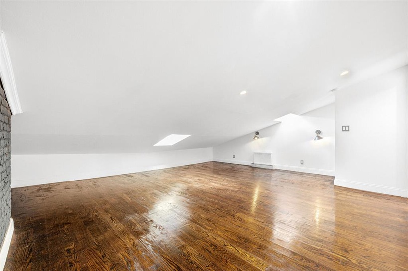 308 Clifton Place Brooklyn, NY 11216 - Photo 30 of 41 a view of empty room with wooden floor