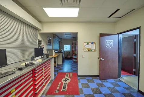 a large room with lots of furniture and a view of a chandelier