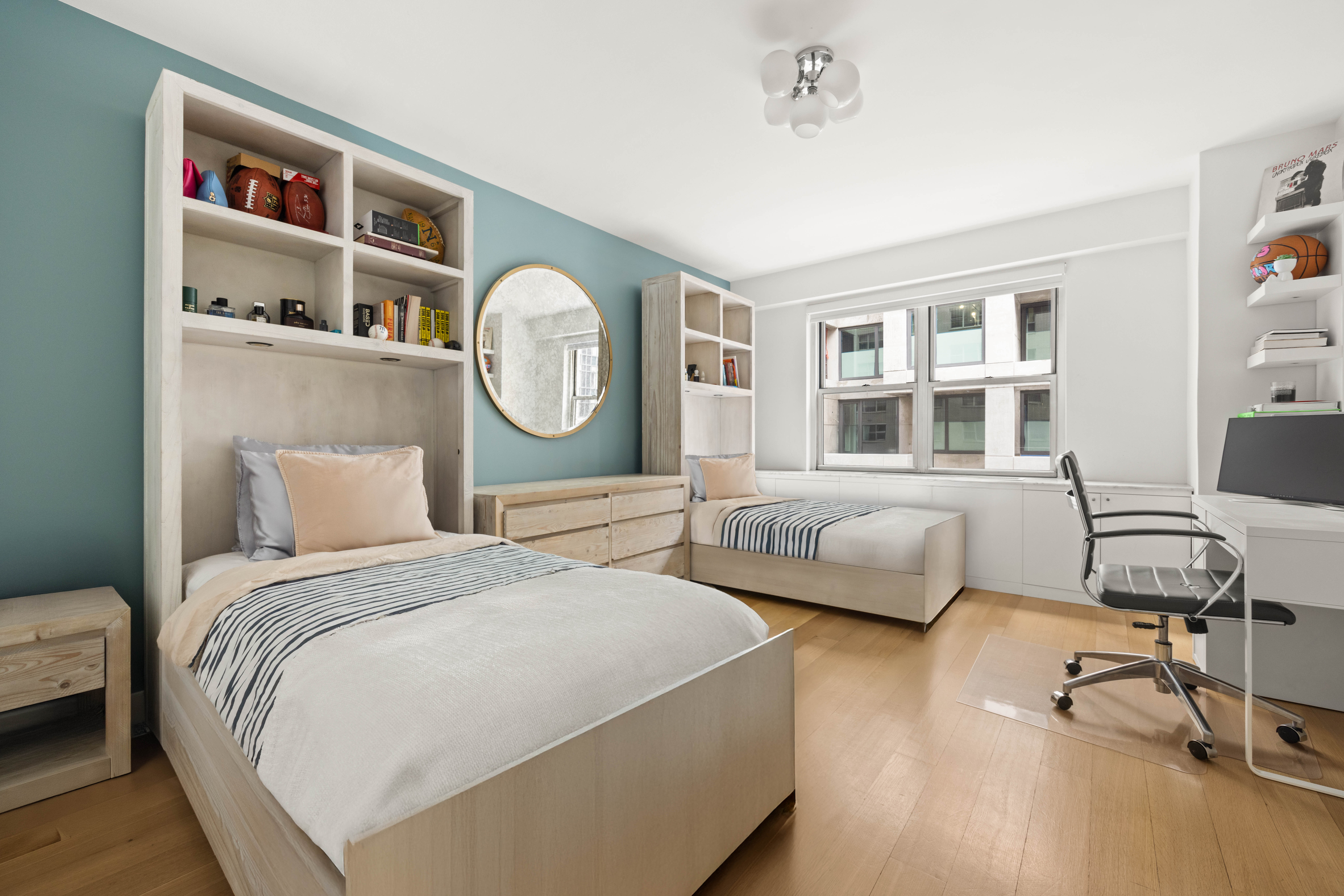 136 East 56th Street, Unit 4EF Manhattan, NY 10022 - Photo 7 of 10 a bedroom with a bed and a couch