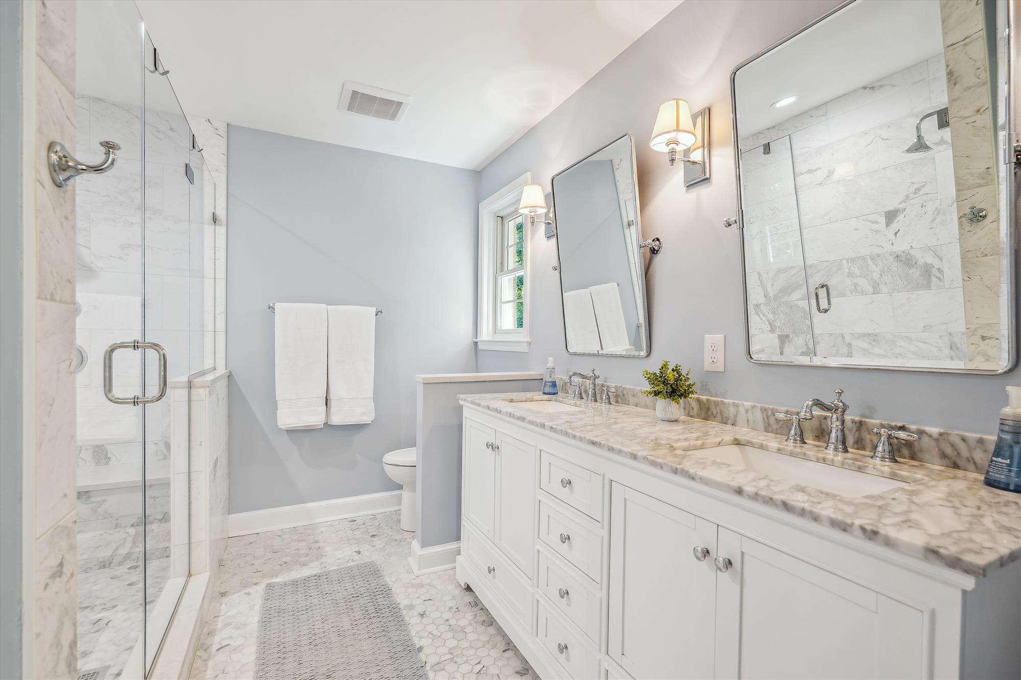 9904 Carter Road Bethesda, MD 20817 - Photo 23 of 41 a bathroom with a granite countertop sink mirror and double