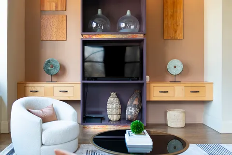 a living room with furniture and a fireplace
