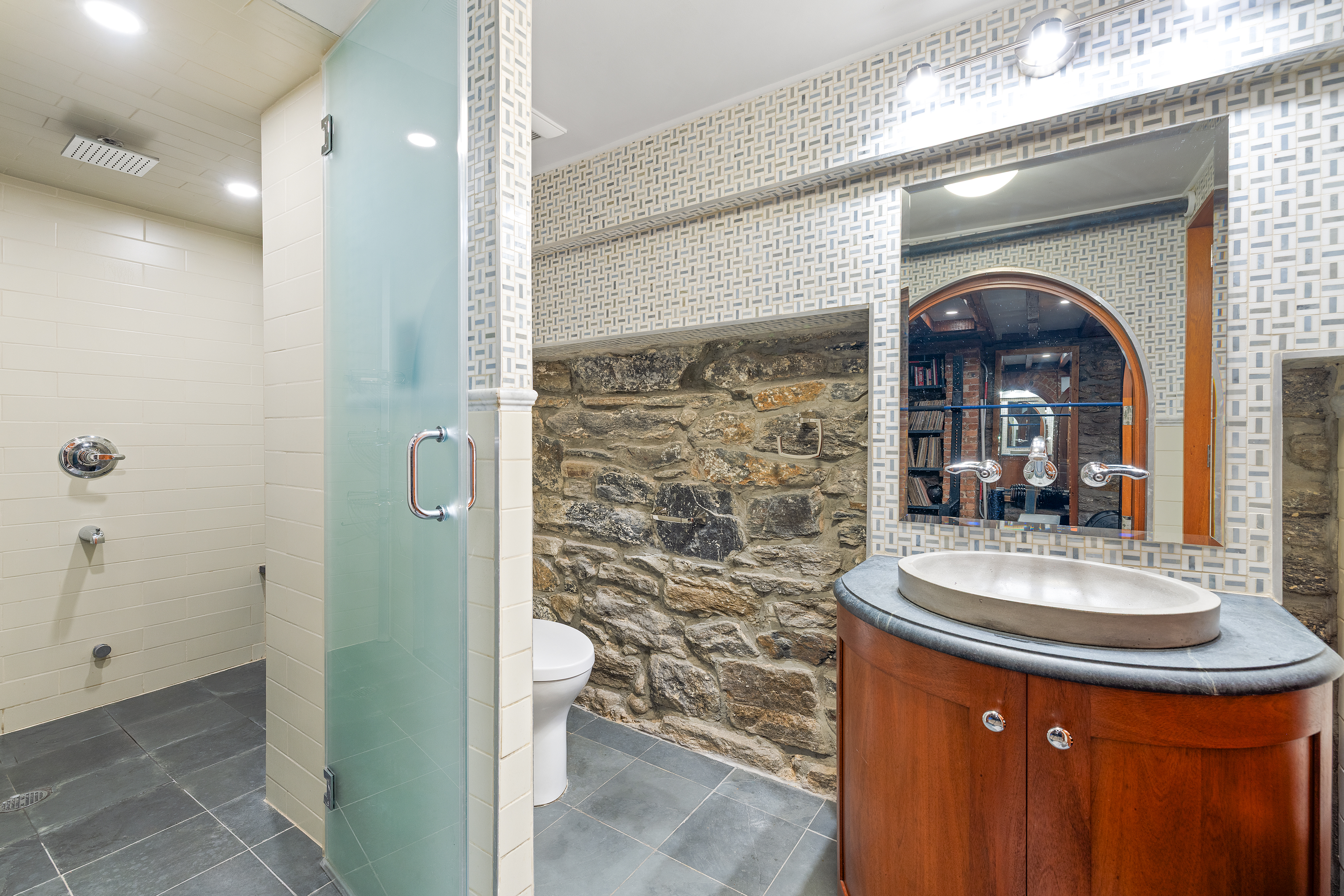 445 Greene Avenue, Unit 1 Brooklyn, NY 11216 - Photo 8 of 12 a bathroom with a sink a toilet and shower