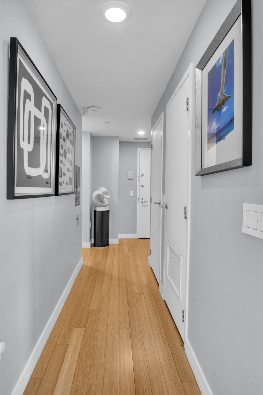 40 West 116th Street, Unit PHA1208 Manhattan, NY 10026 - Photo 12 of 28 a view of a hallway with wooden floor and staircase