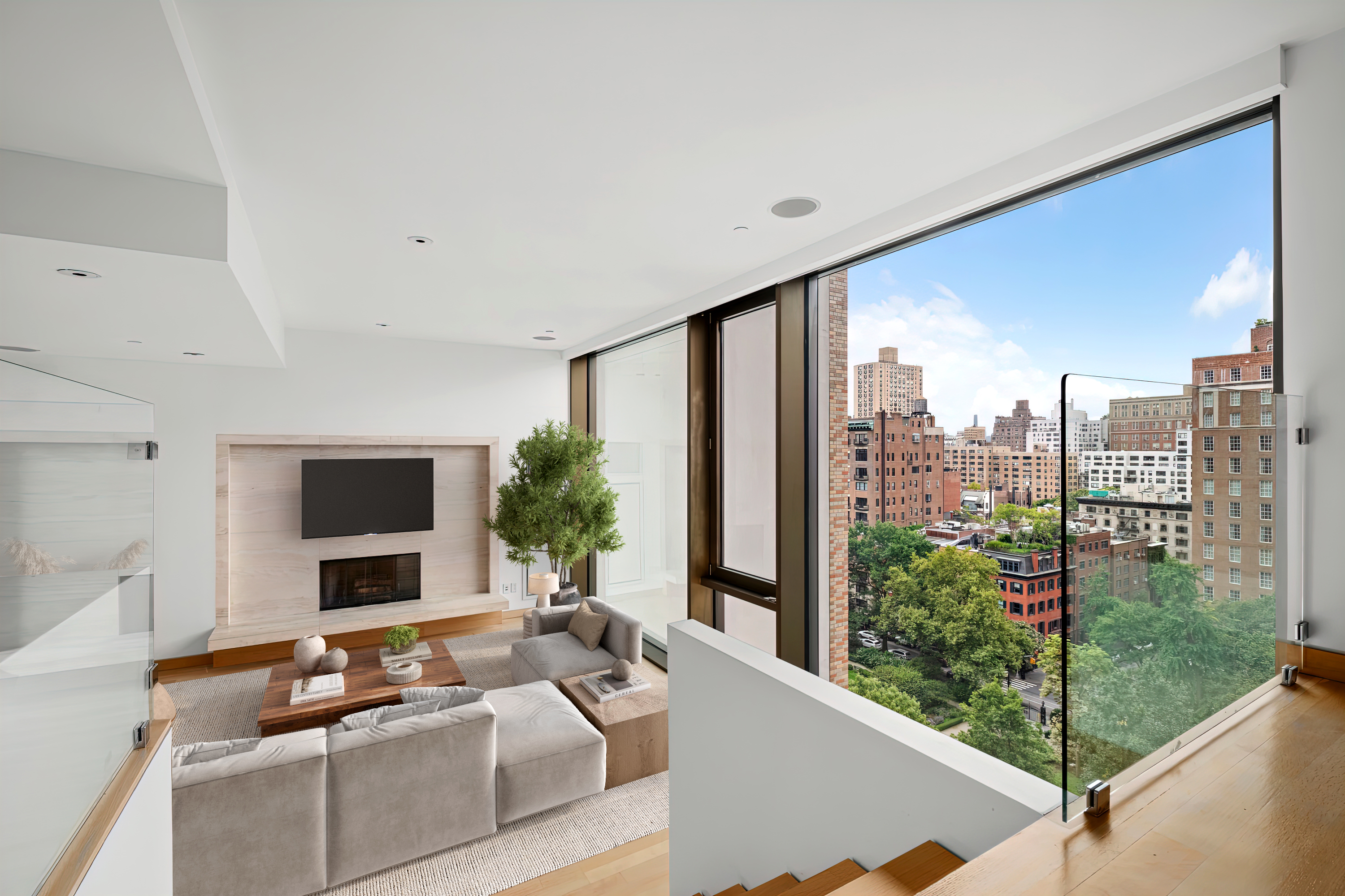 50 Gramercy Park North, Unit 15A Manhattan, NY 10010 - Photo 7 of 29 a living room with furniture tv and a large window
