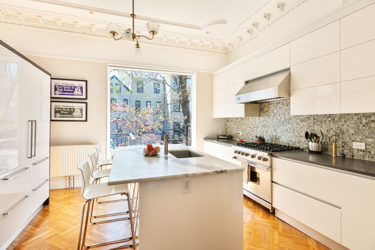 380 3rd Street, Unit PARLOR Brooklyn, NY 11215 - Photo 5 of 19 a kitchen with stainless steel appliances granite countertop a sink stove and cabinets