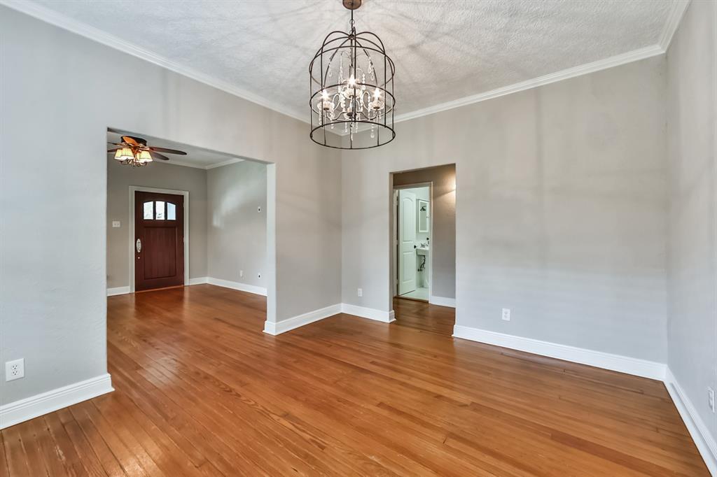 1120 Winston Street Houston, TX 77009 - Photo 9 of 29 a view of an empty room with wooden floor