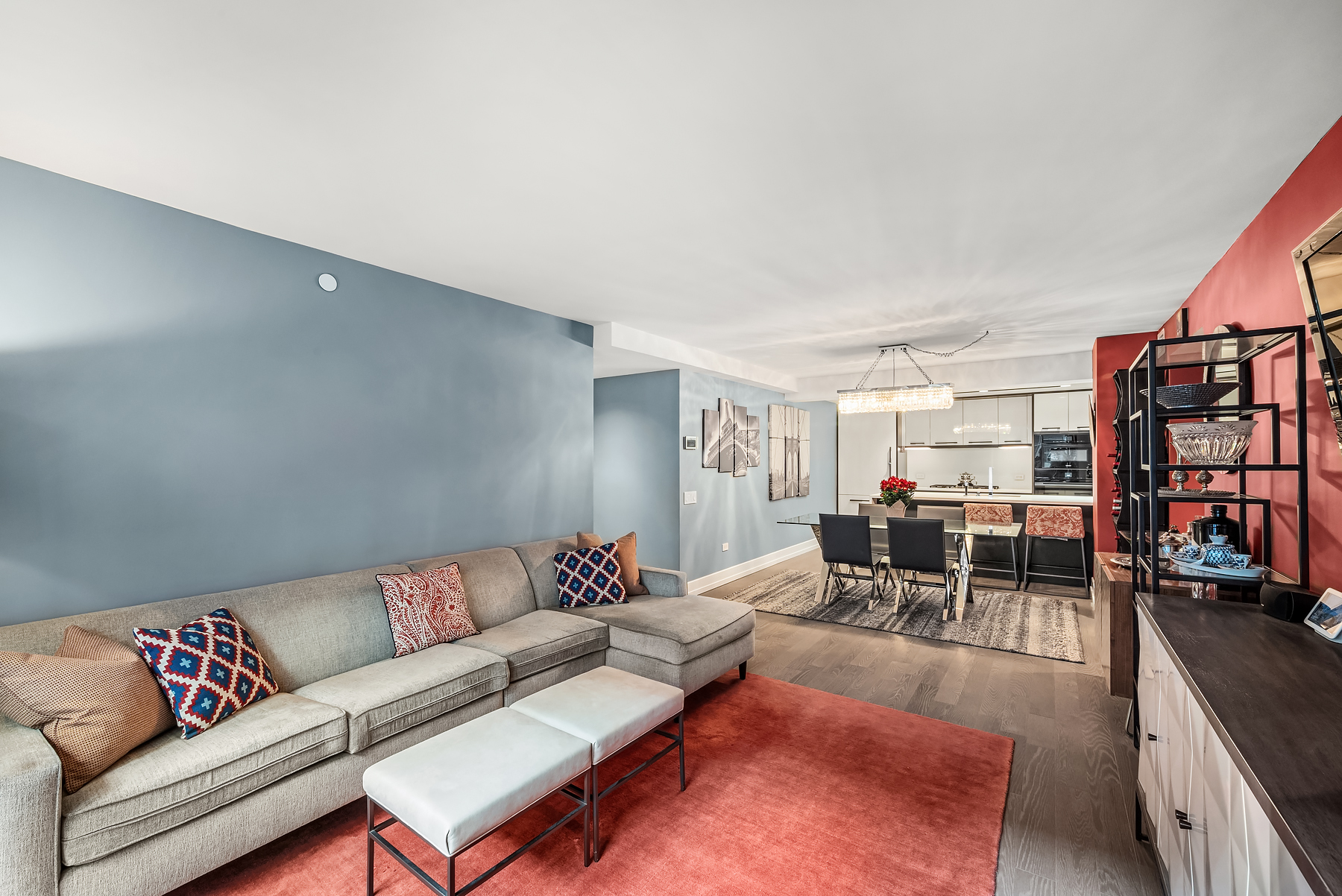 70 Charlton Street, Unit 11A Manhattan, NY 10014 - Photo 4 of 22 a living room with furniture and a large window