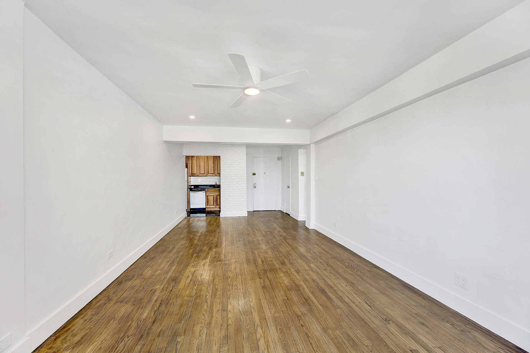 125 Beach 124th Street, Unit 5K Queens, NY 11694 - Photo 11 of 21 wooden floor in an empty room