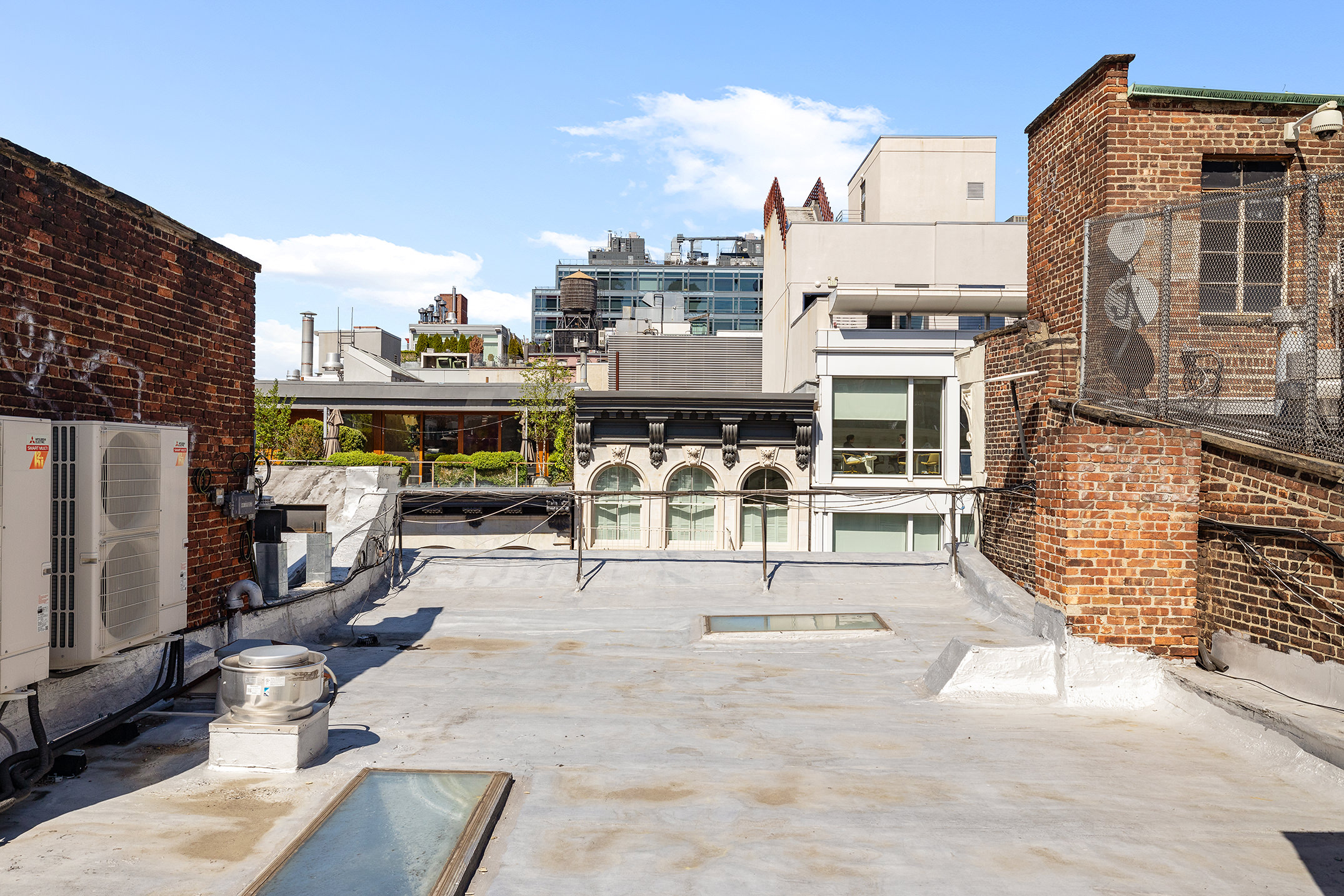 47 Howard Street, Unit 5 Manhattan, NY 10013 - Photo 7 of 9 a view of a city with tall buildings