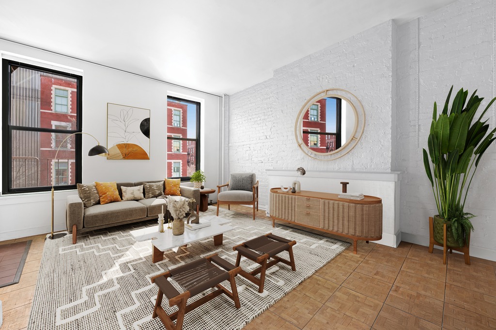 a living room with furniture and a potted plant