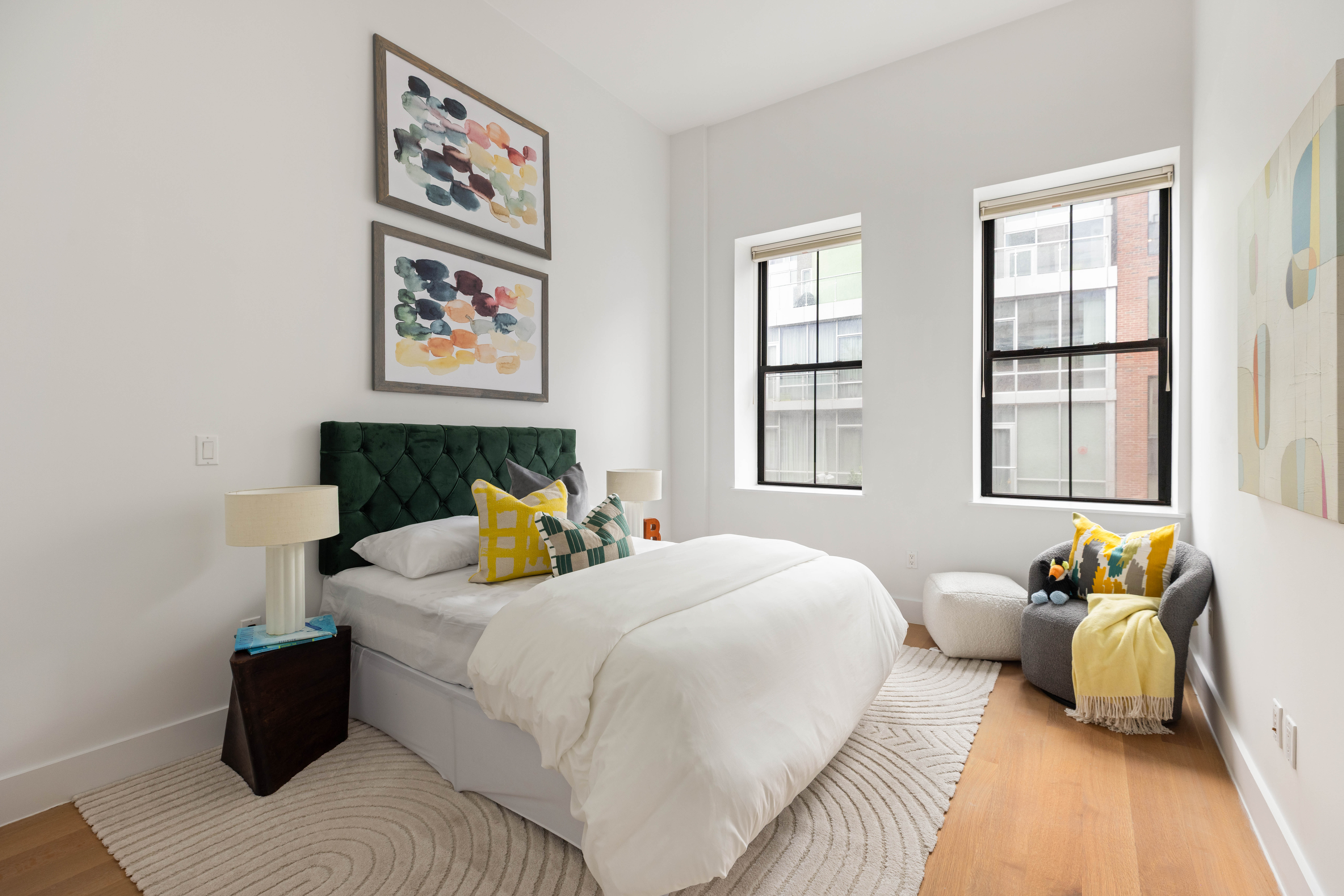 172 North 10th Street, Unit 3D Brooklyn, NY 11211 - Photo 8 of 16 a bedroom with a bed and wooden floor