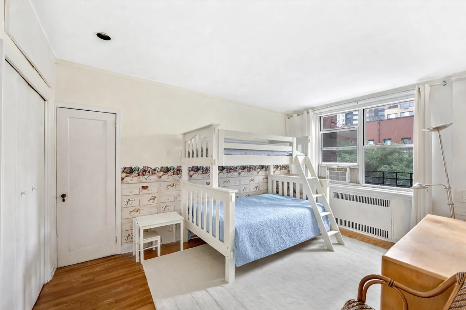a bedroom with a bed couch and window
