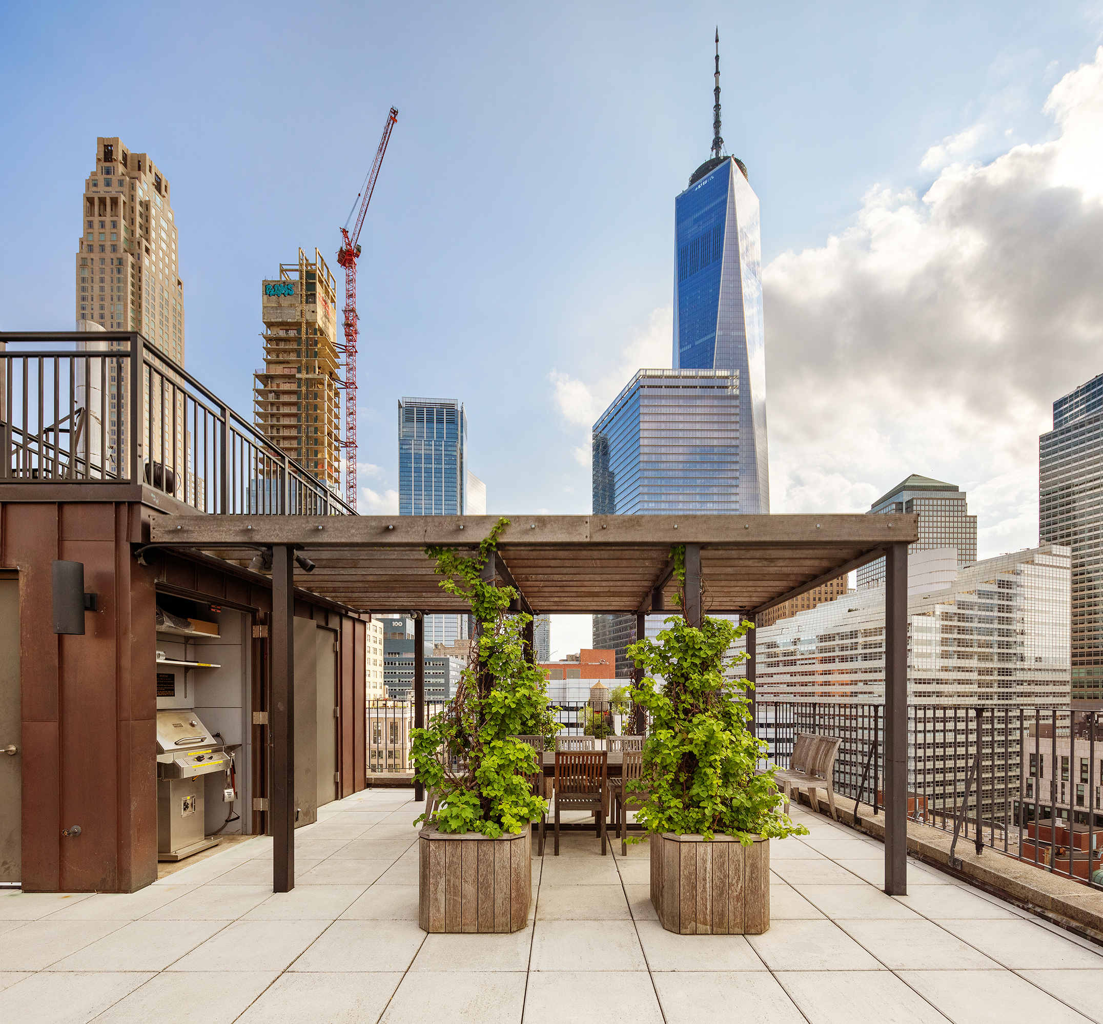 90 West Broadway, Unit 2B Manhattan, NY 10007 - Photo 9 of 12 a front view of a building with potted plants