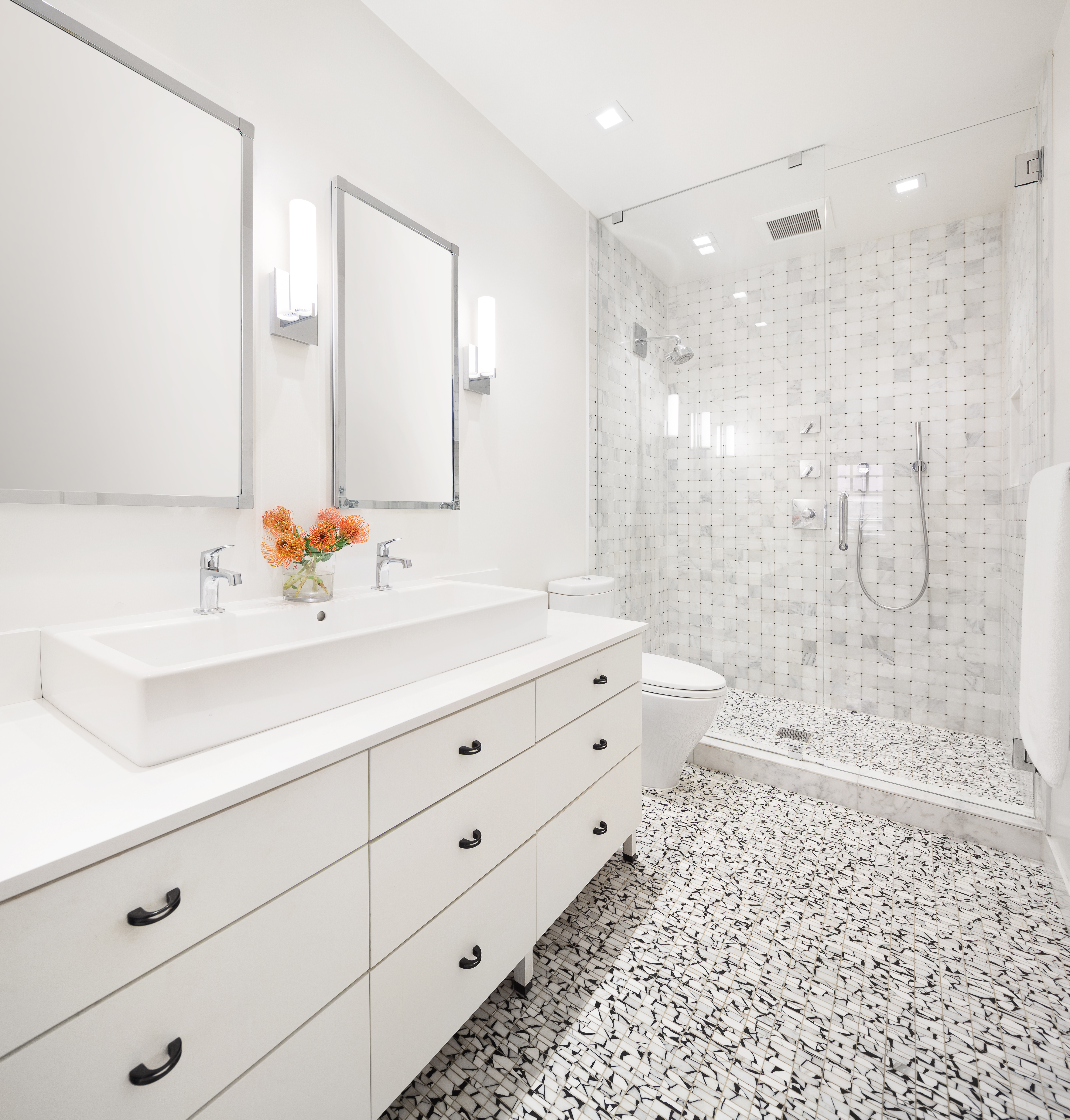687 Greenwich Street, Unit TH7 Manhattan, NY 10014 - Photo 13 of 23 a bathroom with a shower sink and mirror